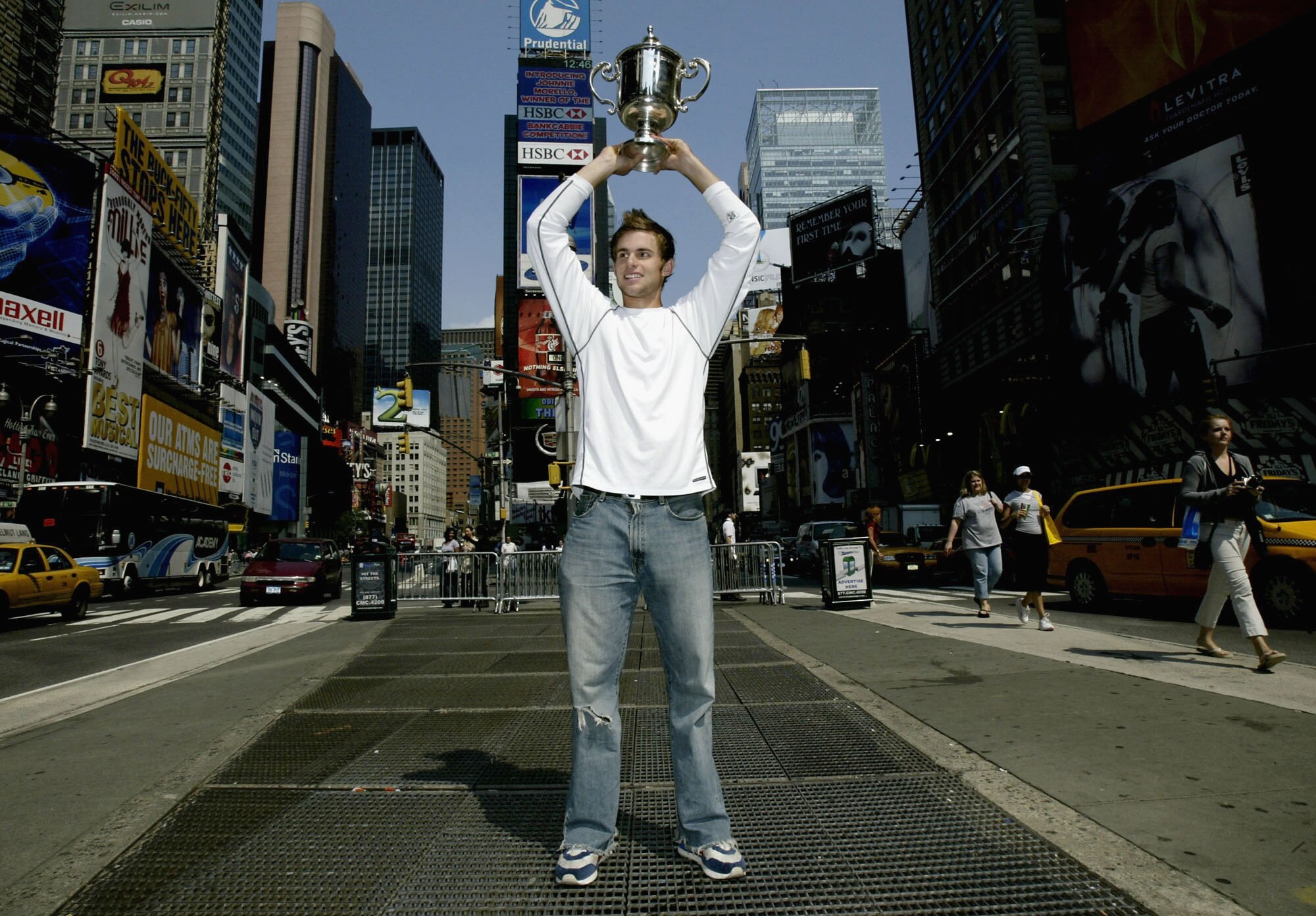NEW YORK - SEPTEMBER 8:  US Open men's singles champion Andy Roddick poses for photographers September 8, 2003 at Time Square in New York City. (Photo by Matthew Stockman/Getty Images)