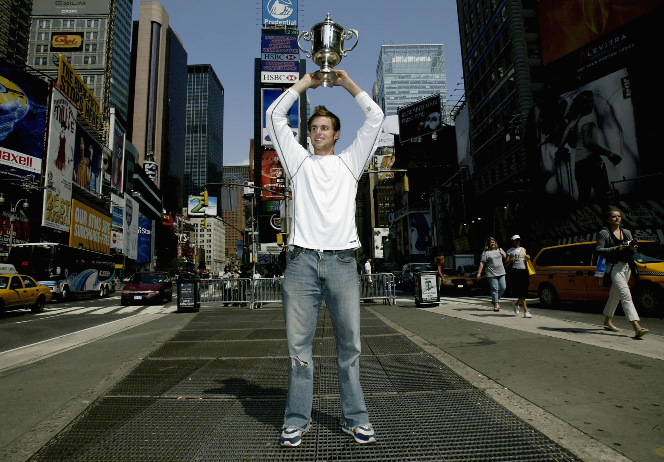 NEW YORK - SEPTEMBER 8:  US Open men's singles champion Andy Roddick poses for photographers September 8, 2003 at Time Square in New York City. (Photo by Matthew Stockman/Getty Images)