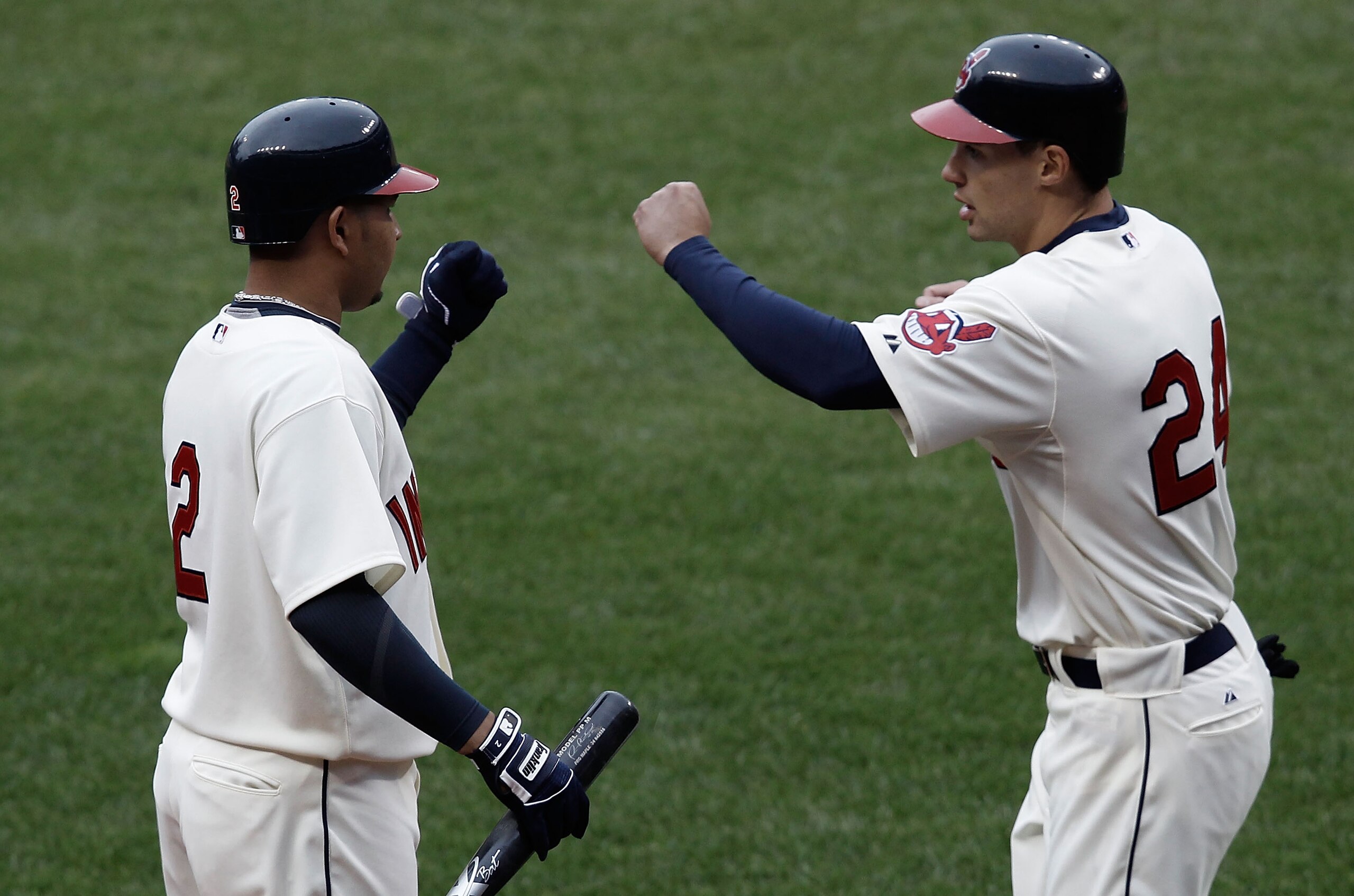 CLEVELAND, OH- APRIL 17: Grady Sizemore #24 is congratulated by teammate Jhonny Peralta #2 of the Cleveland Indians after scoring in the 8th inning against the Chicago White Sox during the game on April 17, 2010 at Progressive Field in Cleveland, Ohio.  (