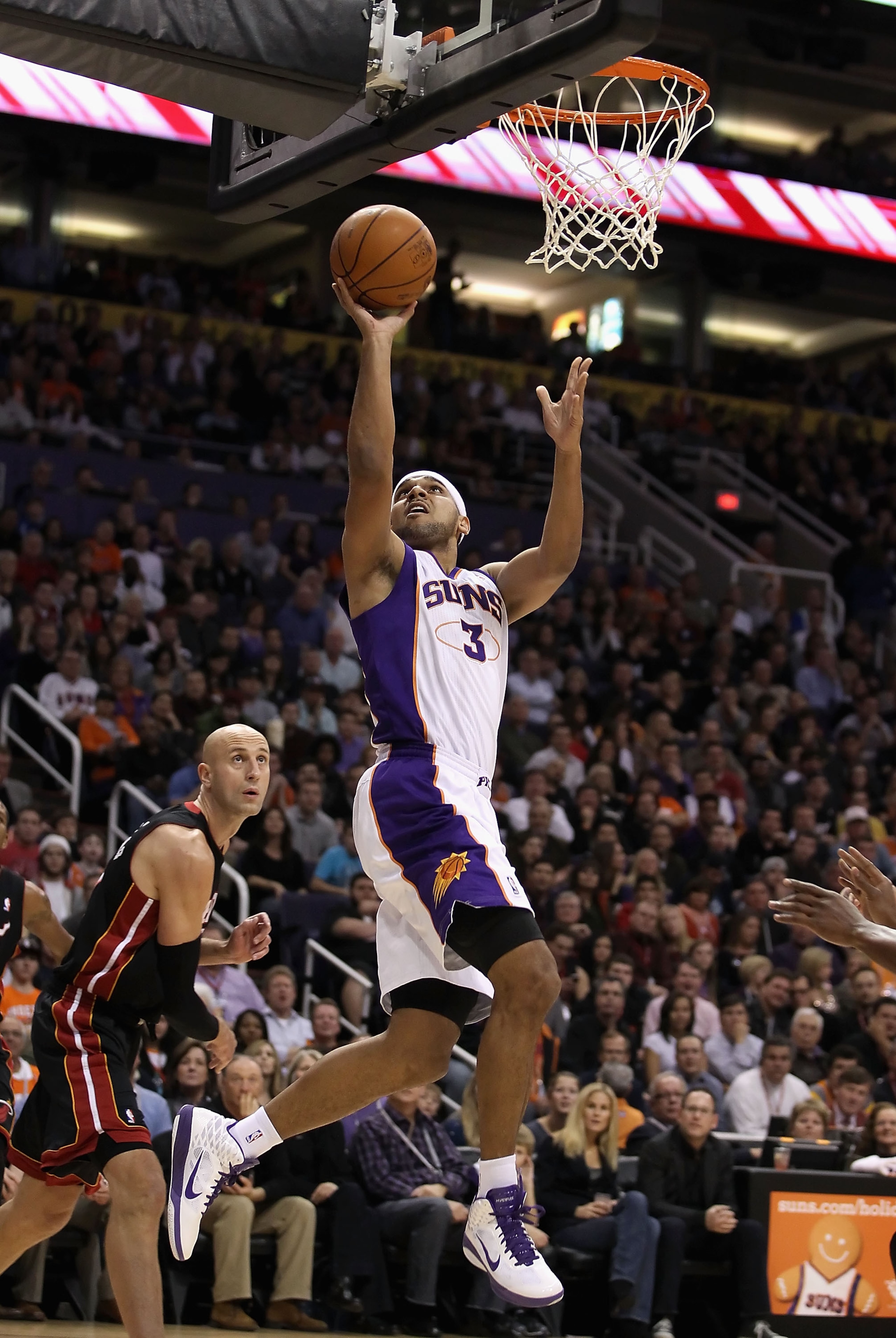 PHOENIX - DECEMBER 23: Jared Dudley #3 of the Phoenix Suns puts up a shot against the Miami Heat during the NBA game at US Airways Center on December 23, 2010 in Phoenix, Arizona. The Heat defeated the Suns 95-83. NOTE TO USER: User expressly acknowledge PHOENIX - DECEMBER 23: Jared Dudley #3 of the Phoenix Suns puts up a shot against the Miami Heat during the NBA game at US Airways Center on December 23, 2010 in Phoenix, Arizona. The Heat defeated the Suns 95-83. NOTE TO USER: User expressly acknowledge
