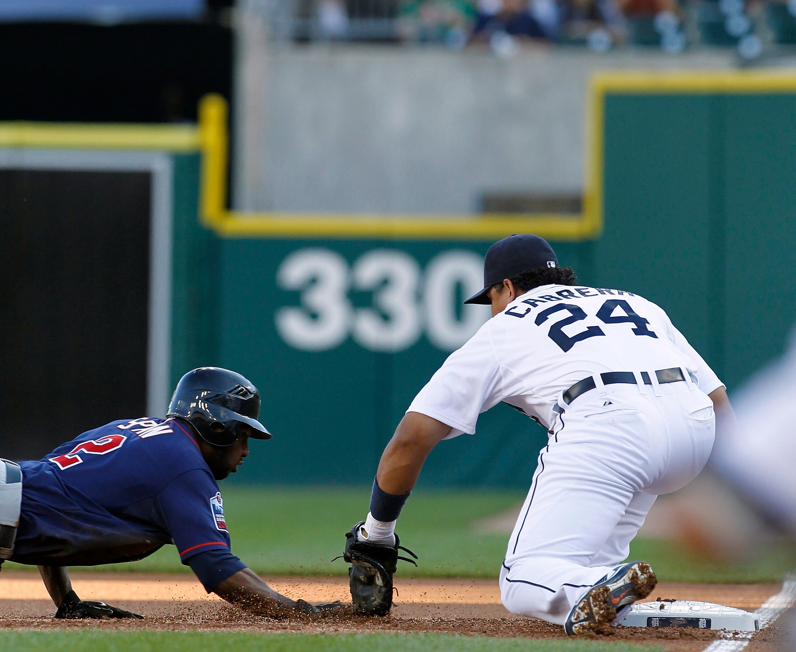 DETROIT - JULY 09: Miguel Cabrera #24 of the Detroit Tigers tags out Denard Span #2 of the Minnesota Twins in the first inning on a pick off play by pitcher Justin Verlander during the game on July 9, 2010 at Comerica Park in Detroit, Michigan. The Tigers