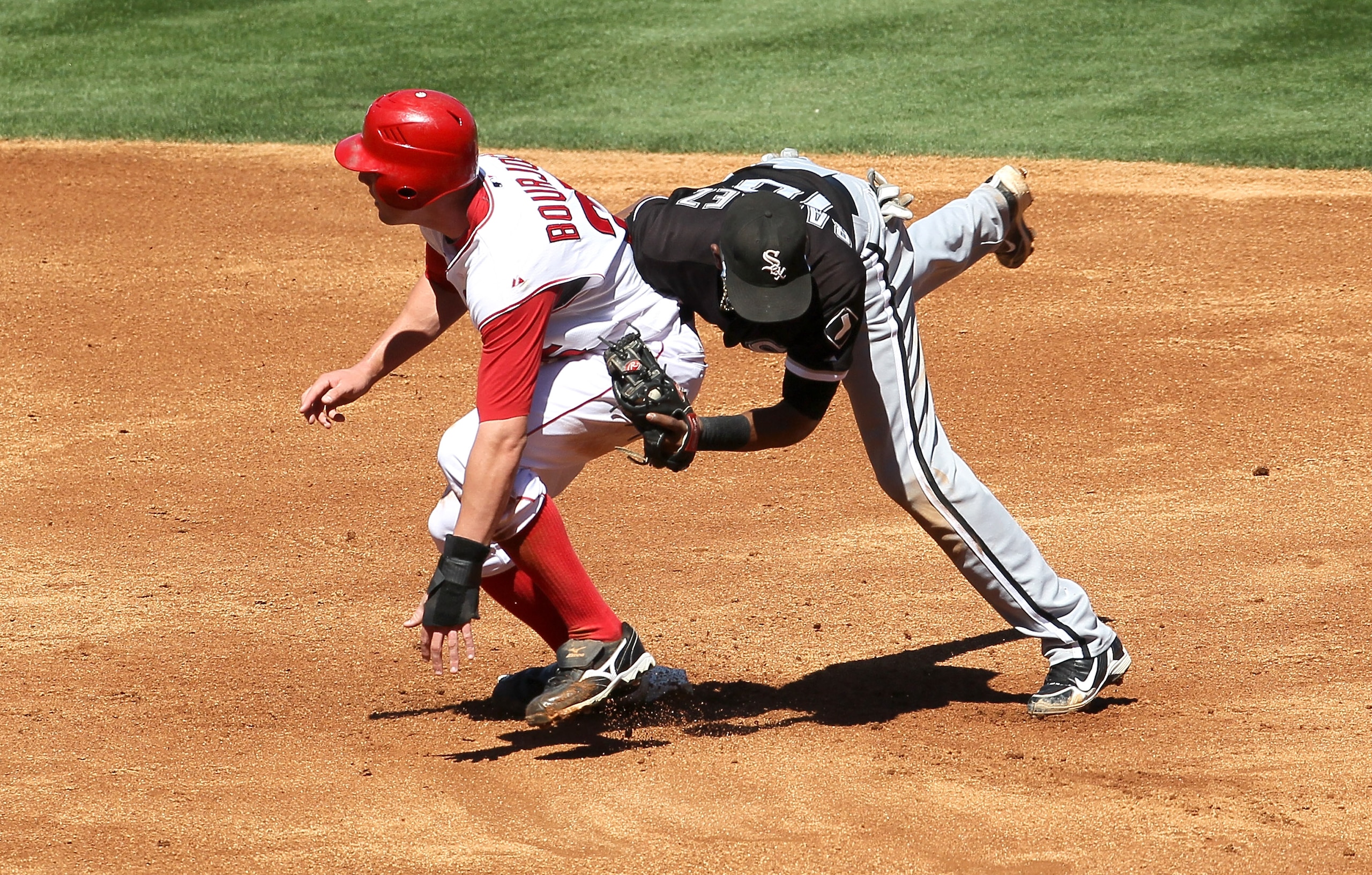 ANAHEIM, CA - SEPTEMBER 26:  Shortstop Alexei Ramirez #10 of the Chicago White Sox tags out Peter Bourjos #25 of the Los Angeles Angels of Anaheim to complete a strike out/caught stealing double play to end the second inning on September 26, 2010 at Angel