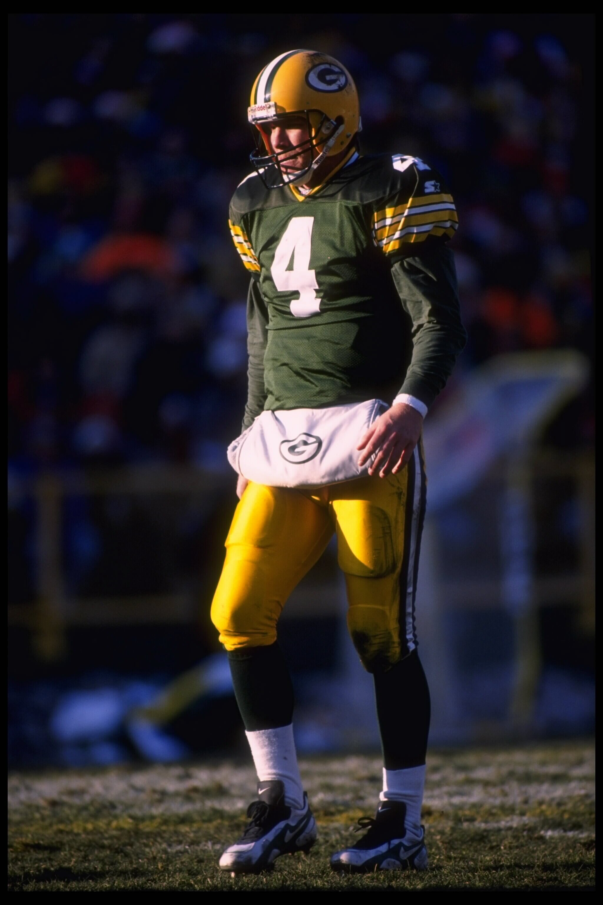 3 Dec 1995:  Quarterback Brett Favre #4 of the Green Bay Packers stands on the field for the lineup against the Cincinnati Bengals at Lambeau Field in Green Bay, Wisconsin.  The Packers defeated the Bengals 24-10.  Mandatory Credit:  Jonathan Daniel/Allsp