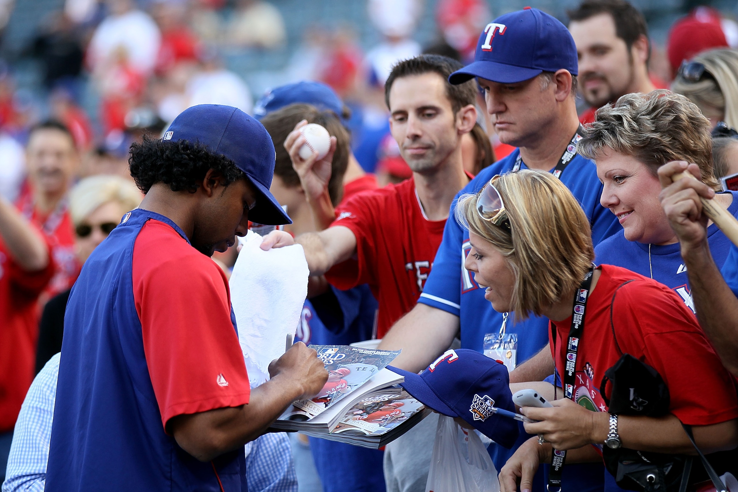 ARLINGTON, TX - NOVEMBER 01:  Elvis Andrus #1 of the Texas Rangers signs autographs for fans during batting practice against the San Francisco Giants in Game Five of the 2010 MLB World Series at Rangers Ballpark in Arlington on November 1, 2010 in Arlingt