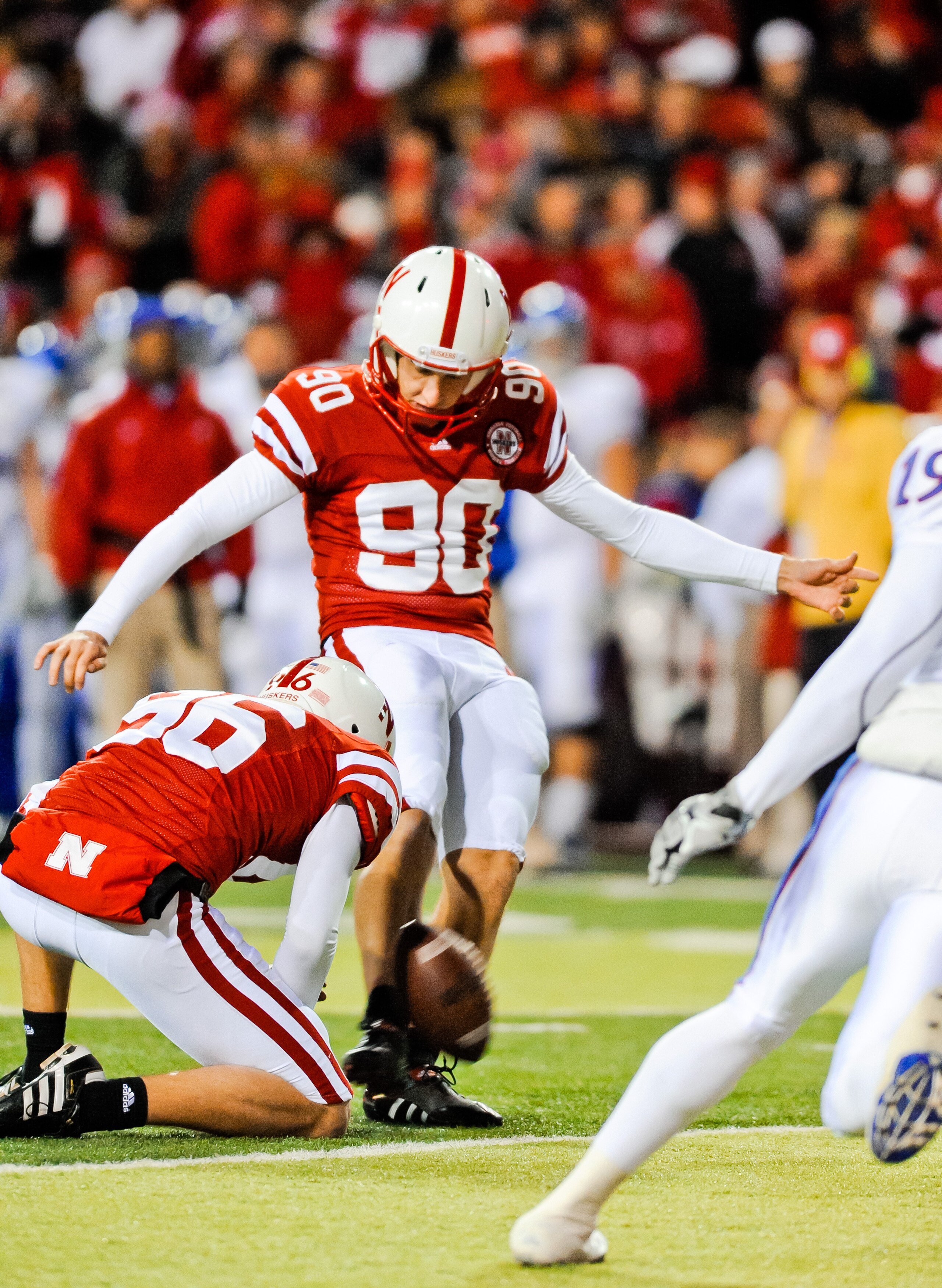 LINCOLN, NE - NOVEMBER 13: Alex Henery #90 of the Nebraska Cornhuskers kicks an extra point against the Kansas Jayhawks during their game at Memorial Stadium on November 13, 2010 in Lincoln, Nebraska. Nebraska Defeated Kansas 20-3. (Photo by Eric Francis/