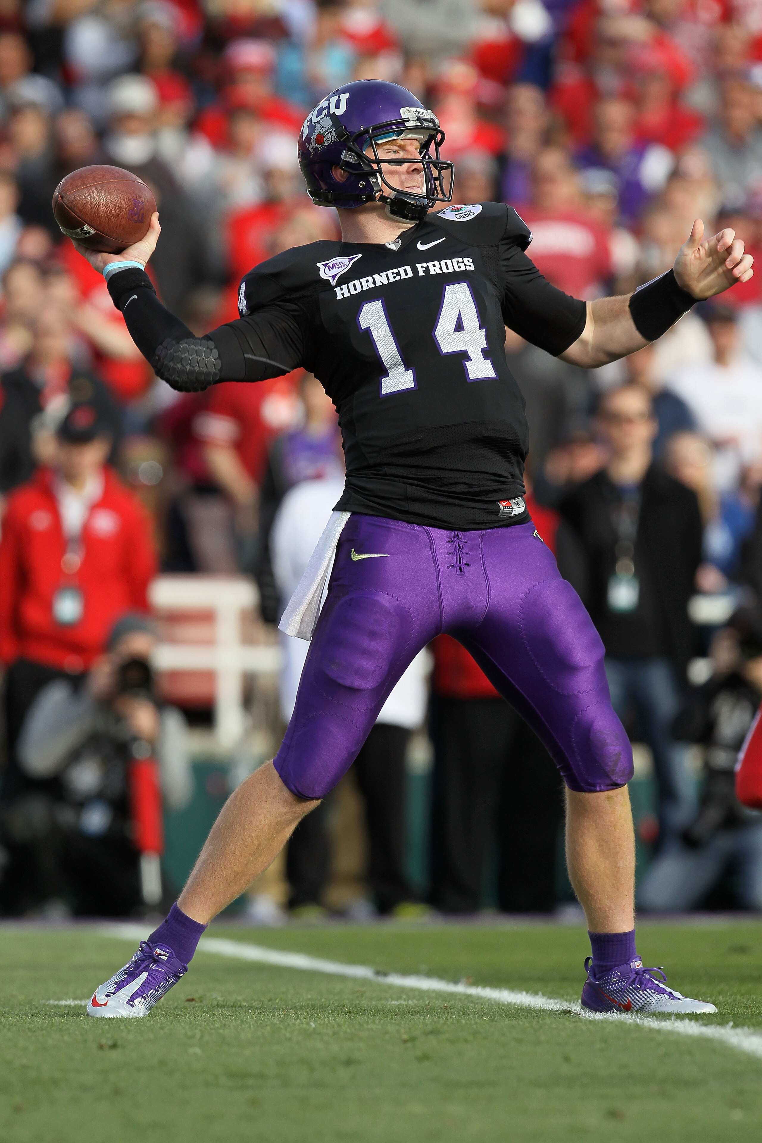 PASADENA, CA - JANUARY 01:  Quarterback Andy Dalton #14 of the TCU Horned Frogs looks to pass against the Wisconsin Badgers during the 97th Rose Bowl game on January 1, 2011 in Pasadena, California.  (Photo by Stephen Dunn/Getty Images)