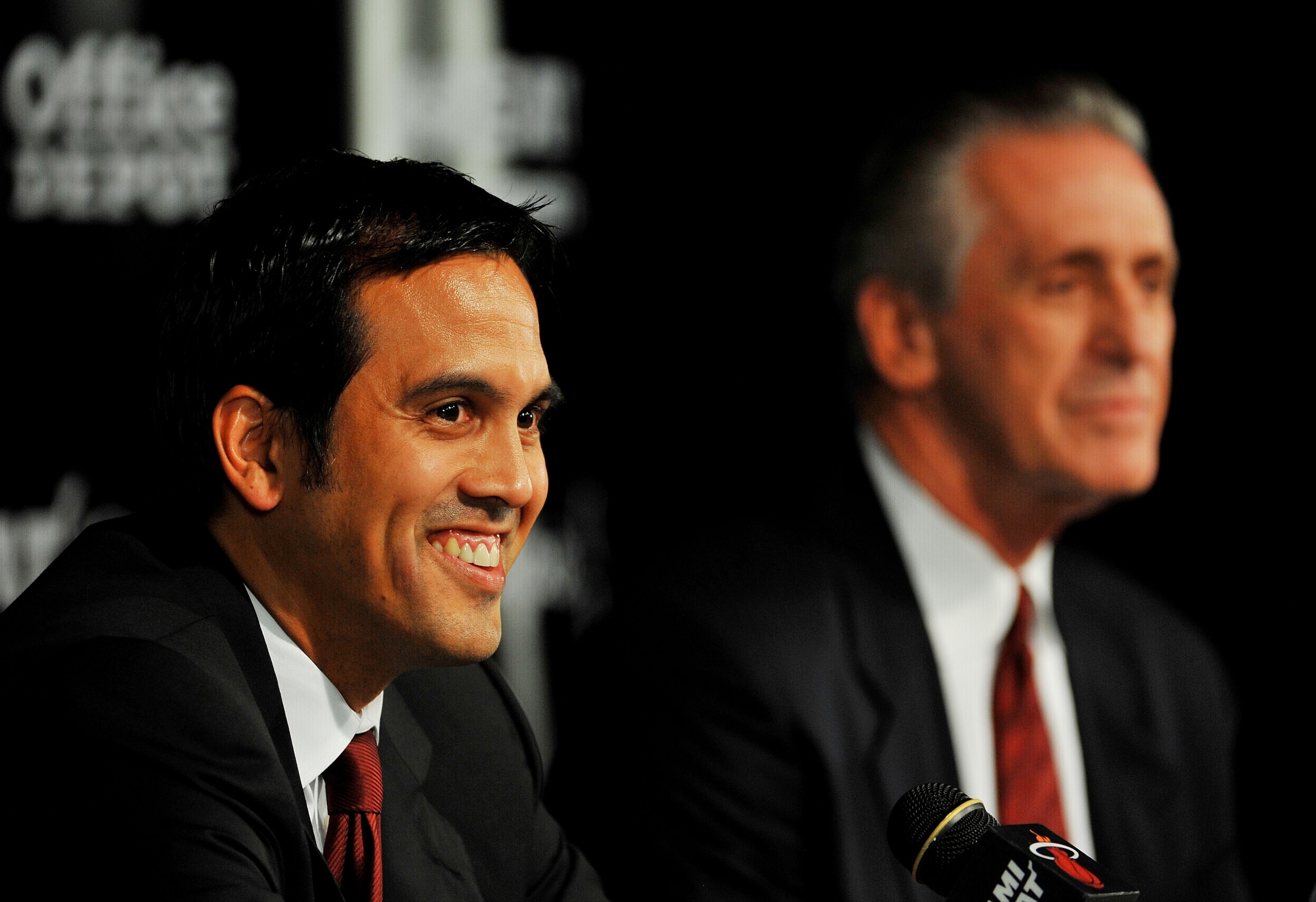 MIAMI - JULY 09:  Head coach Erik Spoelstra (L) and President Pat Riley (R) of the Miami Heat talk during a press conference after a welcome party for new teammates LeBron James, Dwyane Wade, and Chris Bosh at American Airlines Arena on July 9, 2010 in Mi