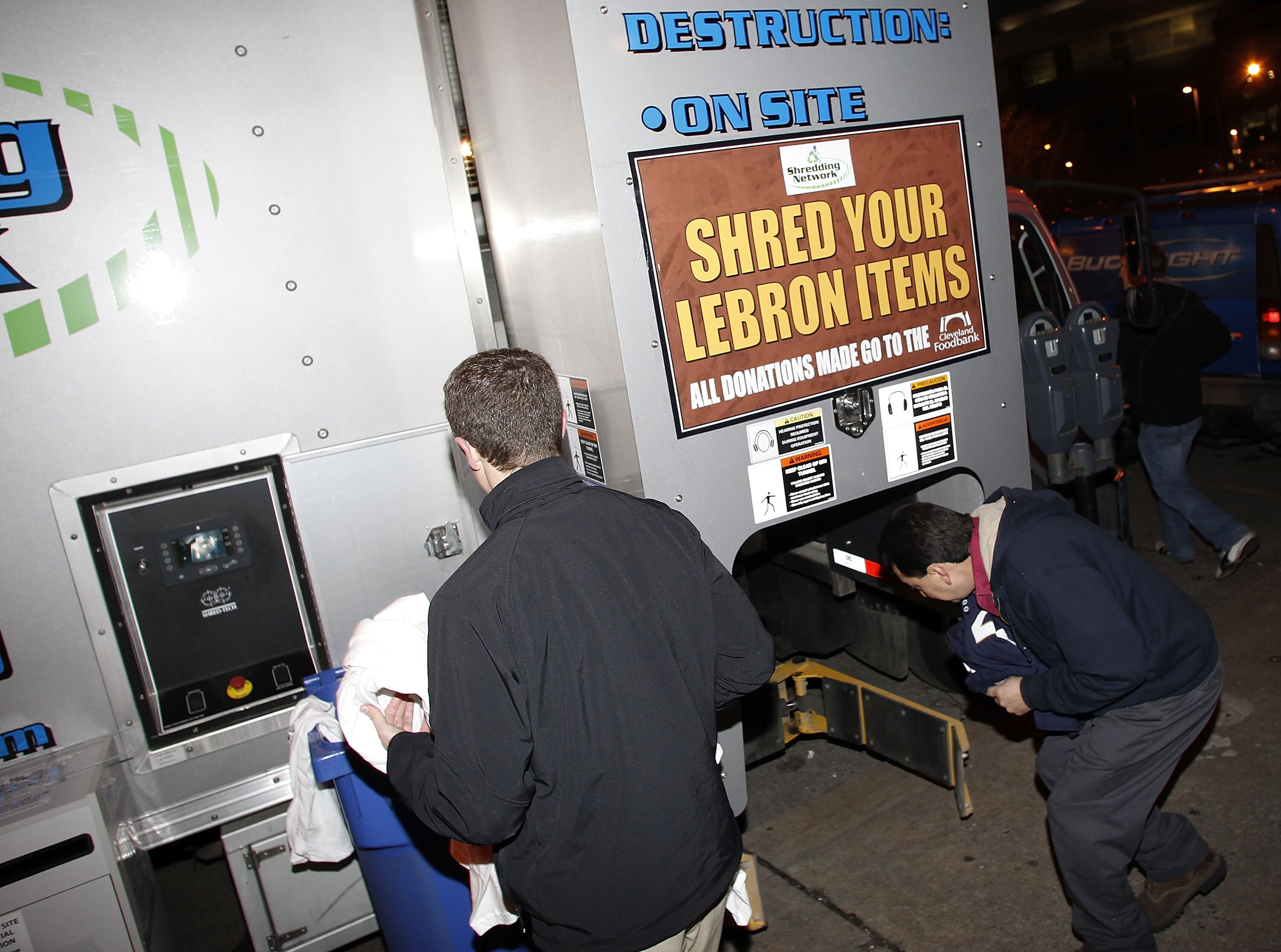 CLEVELAND, OH - DECEMBER 02:  Fans shred there LeBron James gear prior to the Cleveland Cavaliers playing the Miami Heat at Quicken Loans Arena on December 2, 2010 in Cleveland, Ohio. NOTE TO USER: User expressly acknowledges and agrees that, by downloadi