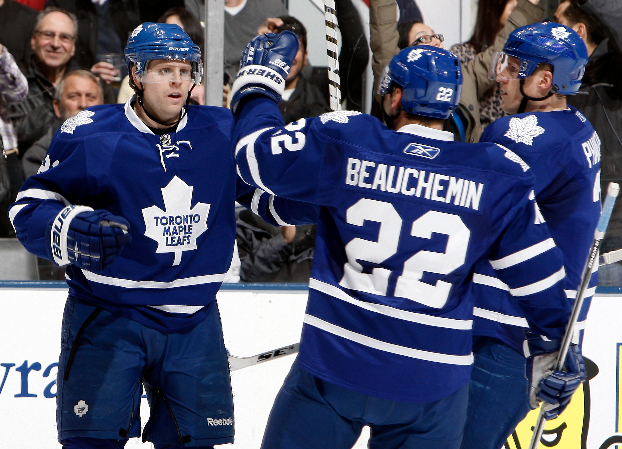 TORONTO, CANADA - JANUARY 6: Phil Kessel #81, Francois Beauchemin #22 and Dion Phaneuf #3 of the Toronto Maple Leafs celebrate Phil Kessel goal against the St. Louis Blues during game action at the Air Canada Centre January 6, 2011 in Toronto, Ontario, C TORONTO, CANADA - JANUARY 6: Phil Kessel #81, Francois Beauchemin #22 and Dion Phaneuf #3 of the Toronto Maple Leafs celebrate Phil Kessel goal against the St. Louis Blues during game action at the Air Canada Centre January 6, 2011 in Toronto, Ontario, C