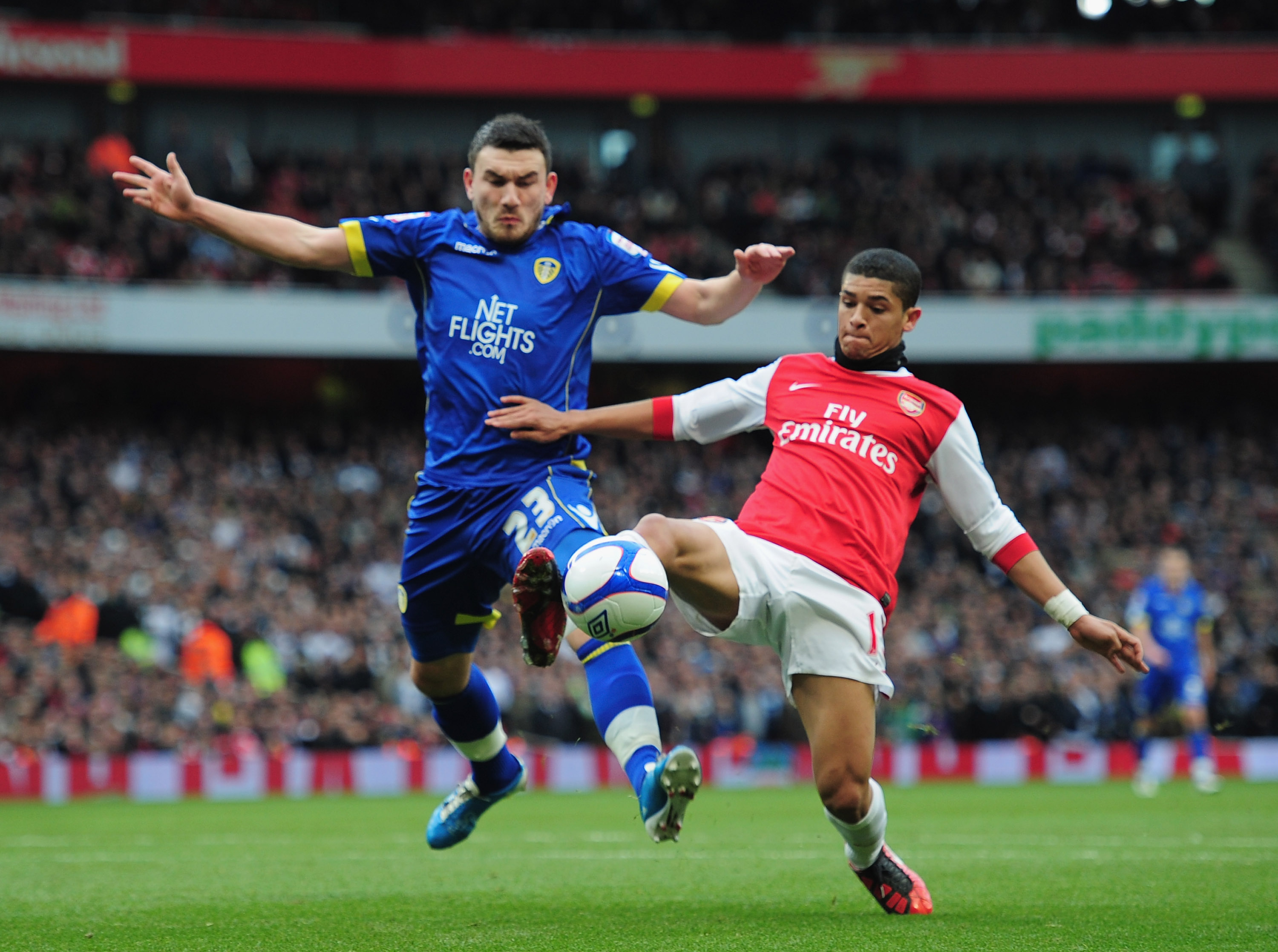 LONDON, ENGLAND - JANUARY 08:  Denilson of Arsenal holds off a challenge from Robert Snodgrass of Leeds United during the FA Cup sponsored by E.ON 3rd Round match between Arsenal and Leeds United at Emirates Stadium on January 8, 2011 in London, England.