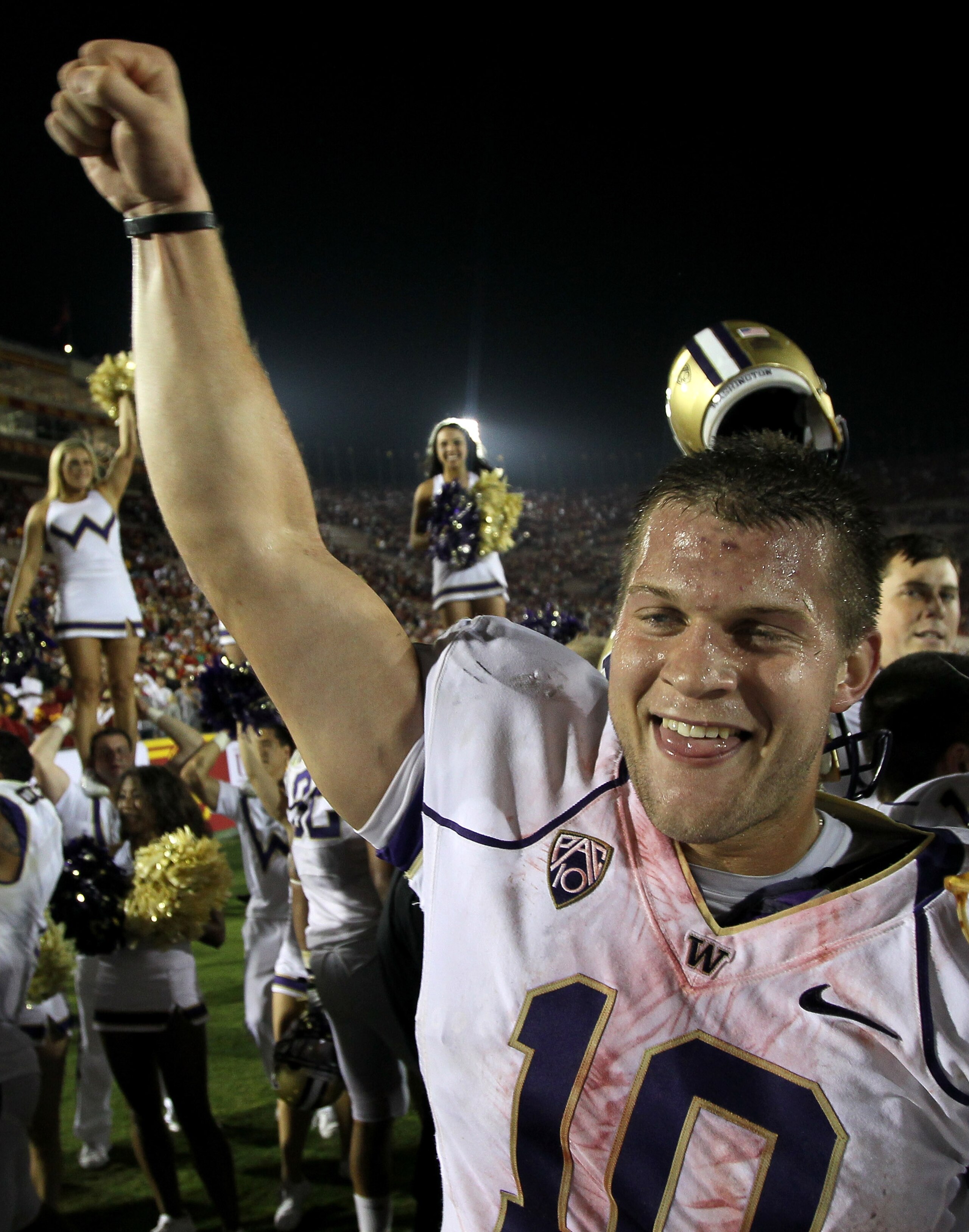 LOS ANGELES - OCTOBER 2:  Quarterback Jake Locker #10 of the Washington Huskies celebrates after the game with the USC Trojans at the Los Angeles Memorial Coliseum on October 2, 2010 in Los Angeles, California.  Washington won 32-31.   (Photo by Stephen D