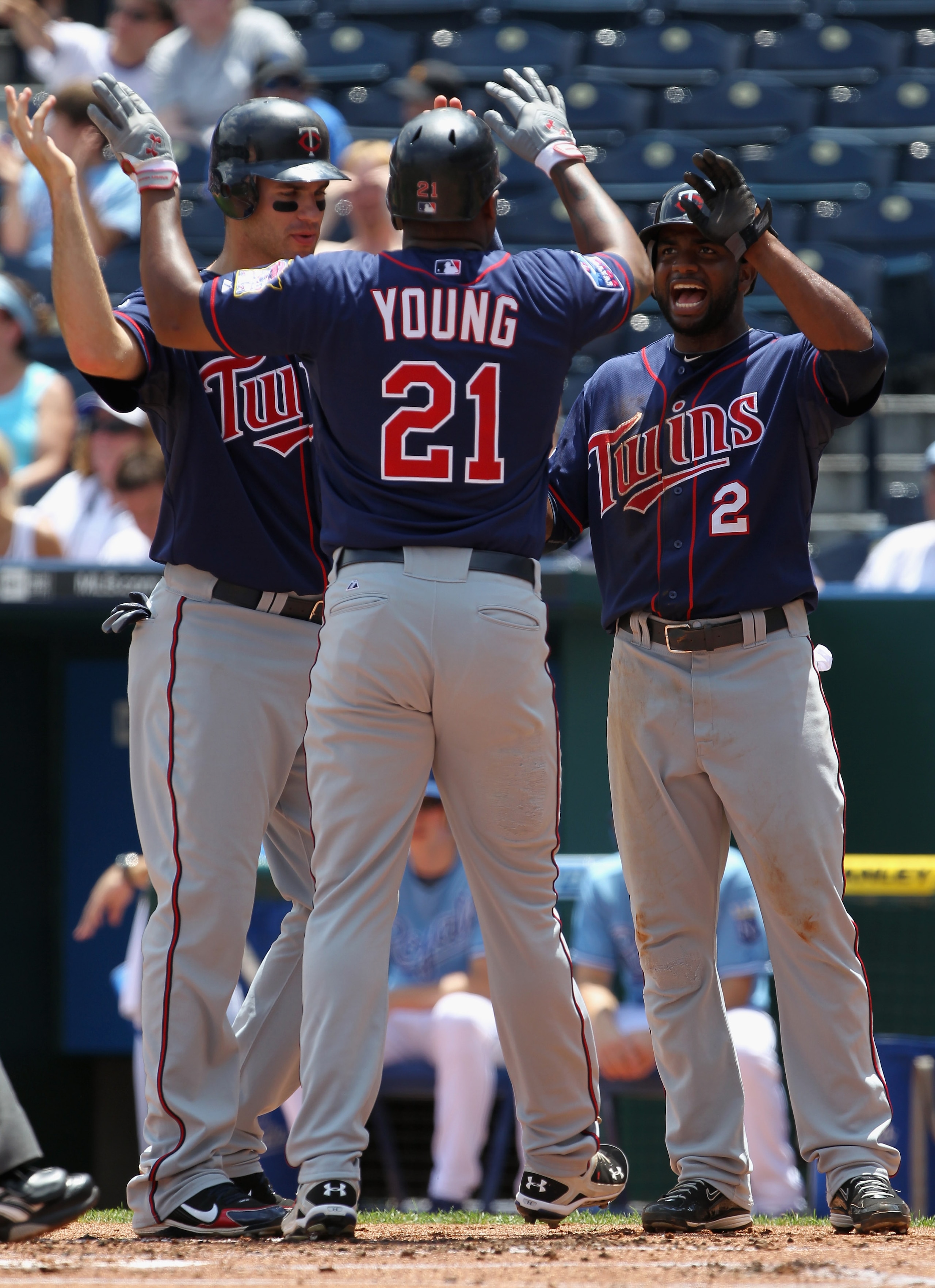 KANSAS CITY, MO - JULY 28: Delmon Young #21 of the Minnesota Twins is congratulated by Joe Mauer #7 and Denard Span #2 after hitting a 3-run home run during the 1st inning of the game against the Kansas City Royals on July 28, 2010 at Kauffman Stadium in KANSAS CITY, MO - JULY 28: Delmon Young #21 of the Minnesota Twins is congratulated by Joe Mauer #7 and Denard Span #2 after hitting a 3-run home run during the 1st inning of the game against the Kansas City Royals on July 28, 2010 at Kauffman Stadium in