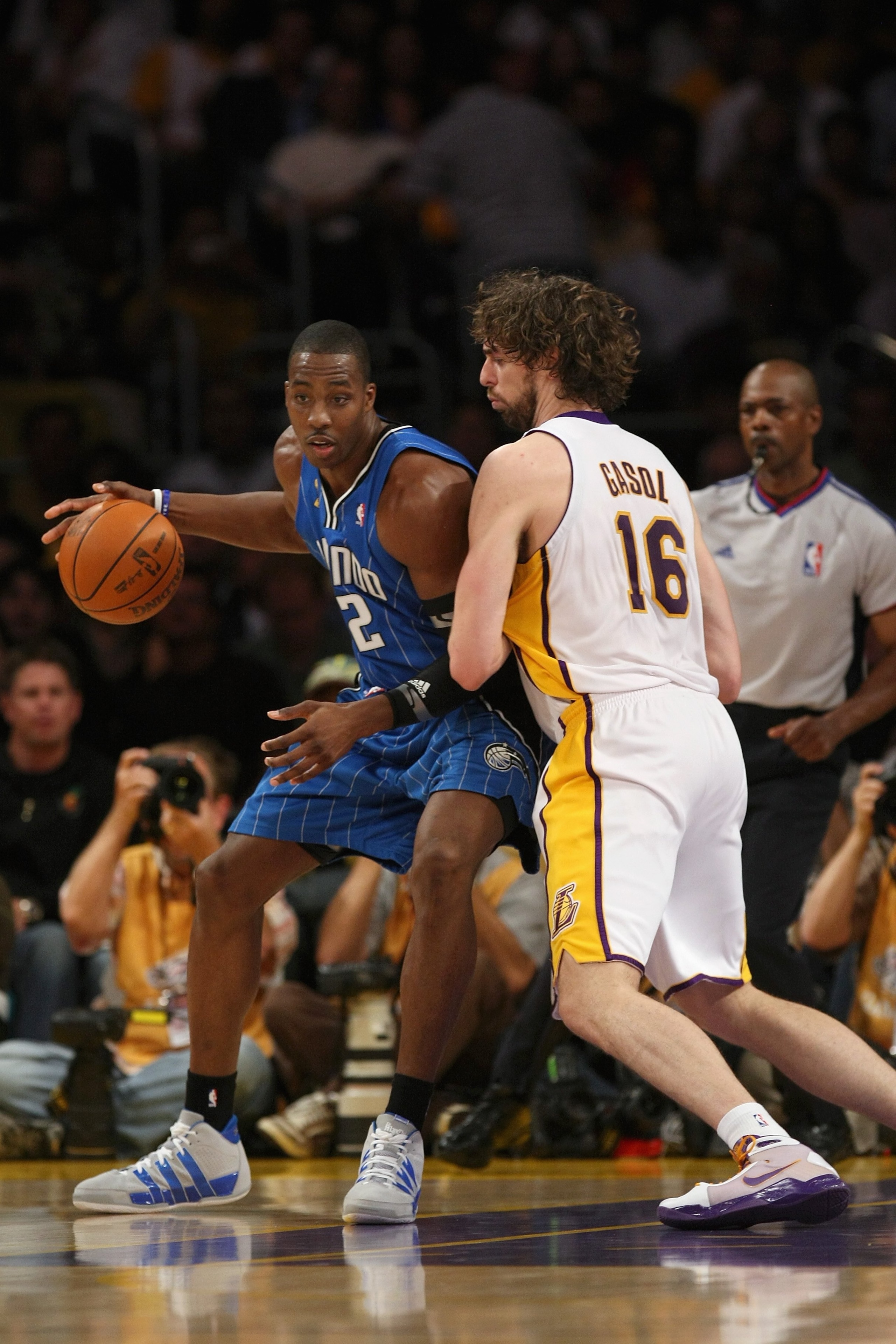 LOS ANGELES - JUNE 7:  Dwight Howard #12 of the Orlando Magic maneuvers against Pau Gasol #16 of the Los Angeles Lakers in Game Two of the 2009 NBA Finals at Staples Center on June 7, 2009 in Los Angeles, California.  The Lakers won 101-96 in overtime.  N
