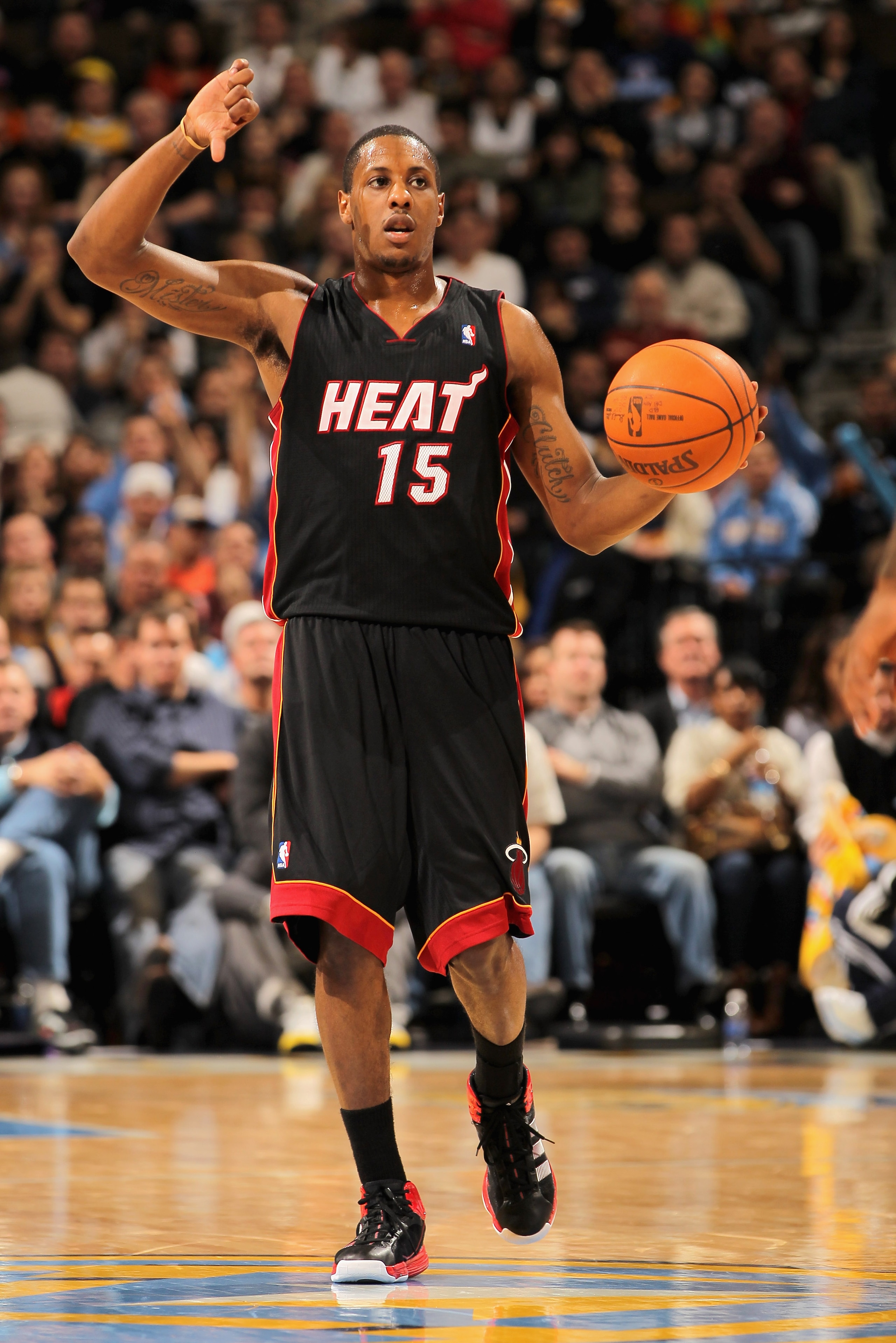 DENVER, CO - JANUARY 13: Mario Chalmers #15 of the Miami Heat dribbles the ball against the Denver Nuggets at the Pepsi Center on January 13, 2011 in Denver, Colorado. The Nuggets defeated the Heat 130-102. NOTE TO USER: User expressly acknowledges and a DENVER, CO - JANUARY 13: Mario Chalmers #15 of the Miami Heat dribbles the ball against the Denver Nuggets at the Pepsi Center on January 13, 2011 in Denver, Colorado. The Nuggets defeated the Heat 130-102. NOTE TO USER: User expressly acknowledges and a