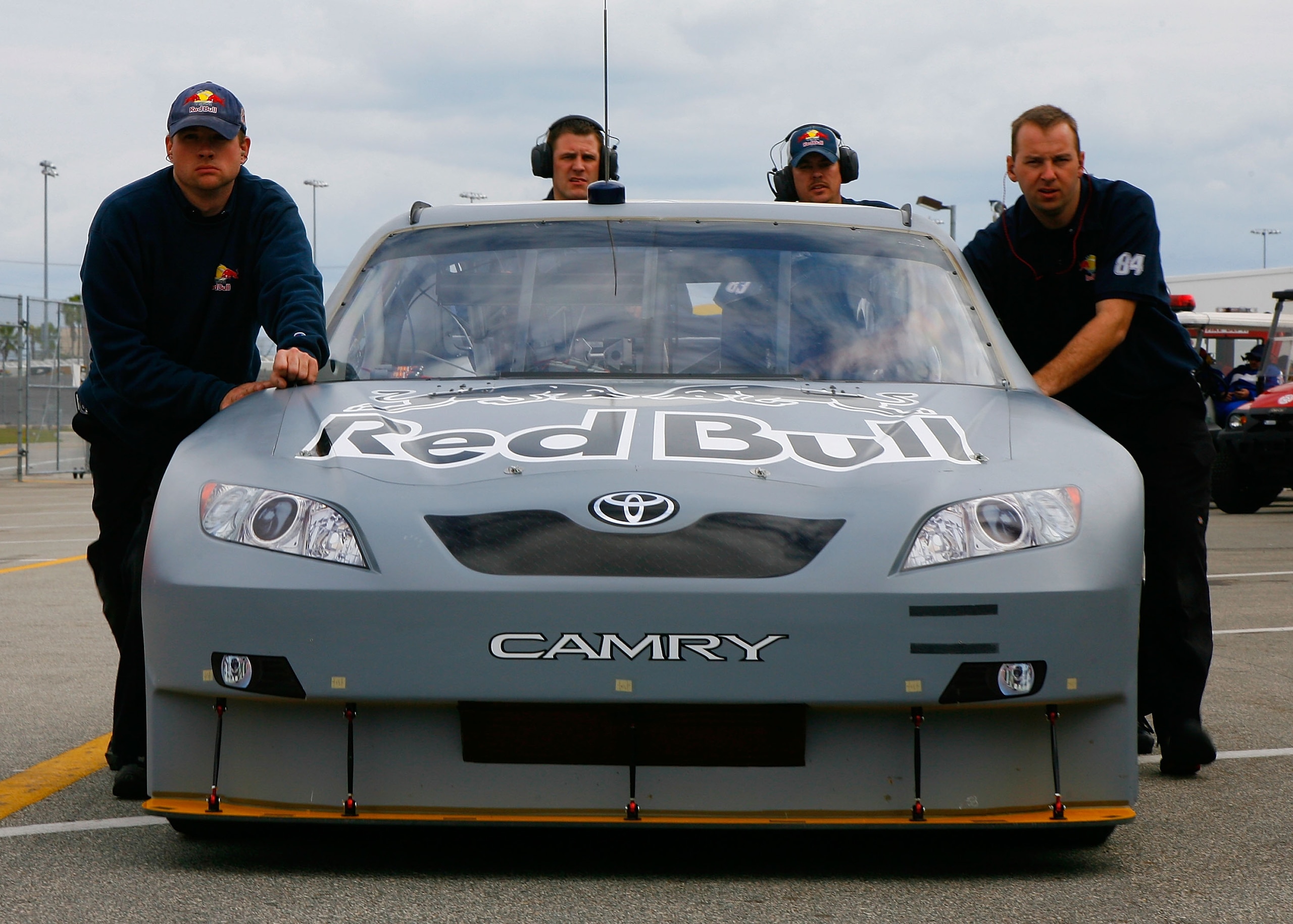 DAYTONA BEACH, FL - JANUARY 16:  The #83 Red Bull Toyota, driven by Brian Vickers is pushed through the garage during NASCAR testing at Daytona International Speedway on January 16, 2008 in Daytona Beach, Florida.  (Photo by Rusty Jarrett/Getty Images for