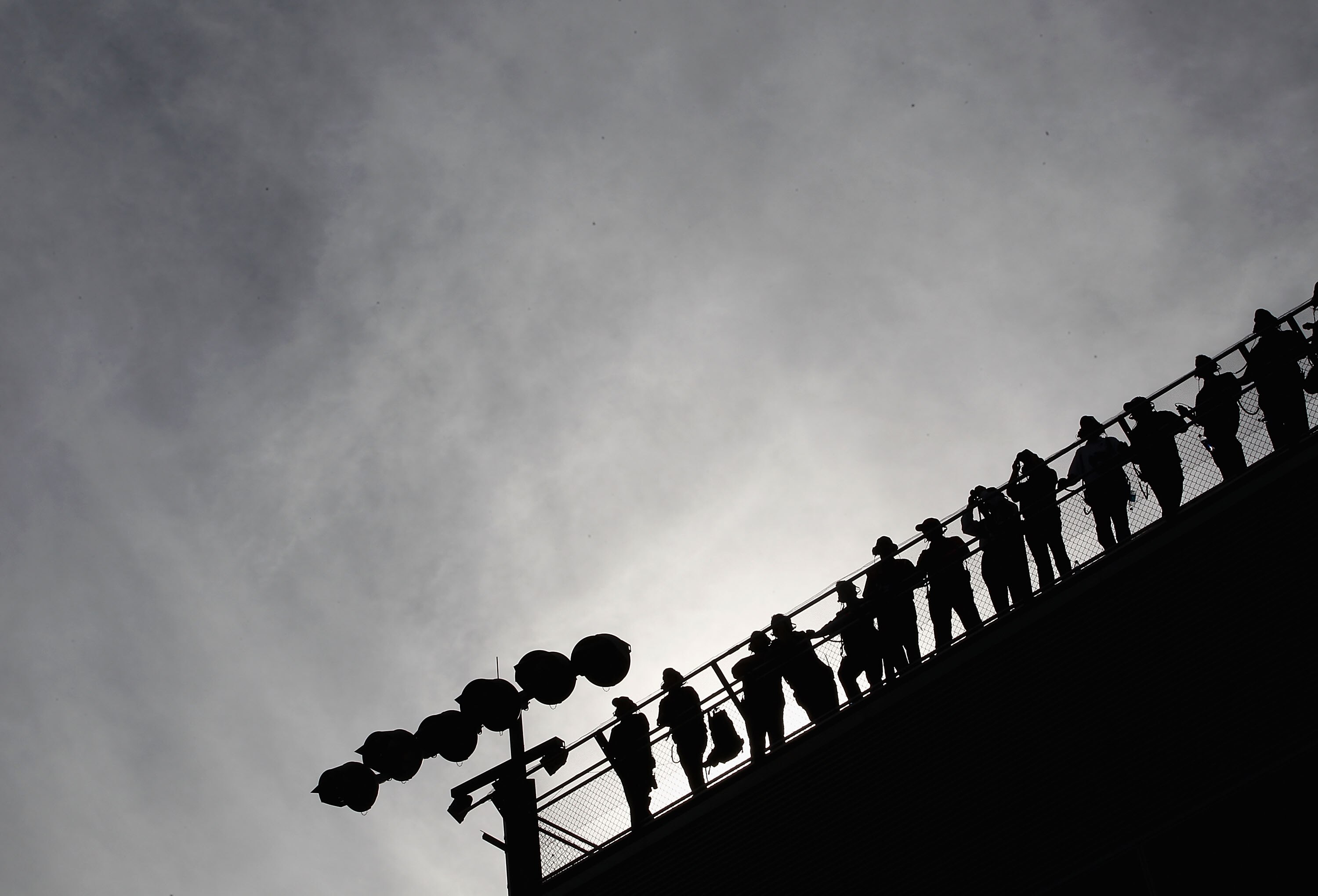 AVONDALE, AZ - NOVEMBER 14:  Team spotters watch race action during the NASCAR Sprint Cup Series Kobalt Tools 500 at Phoenix International Raceway on November 14, 2010 in Avondale, Arizona.  (Photo by Christian Petersen/Getty Images for NASCAR)