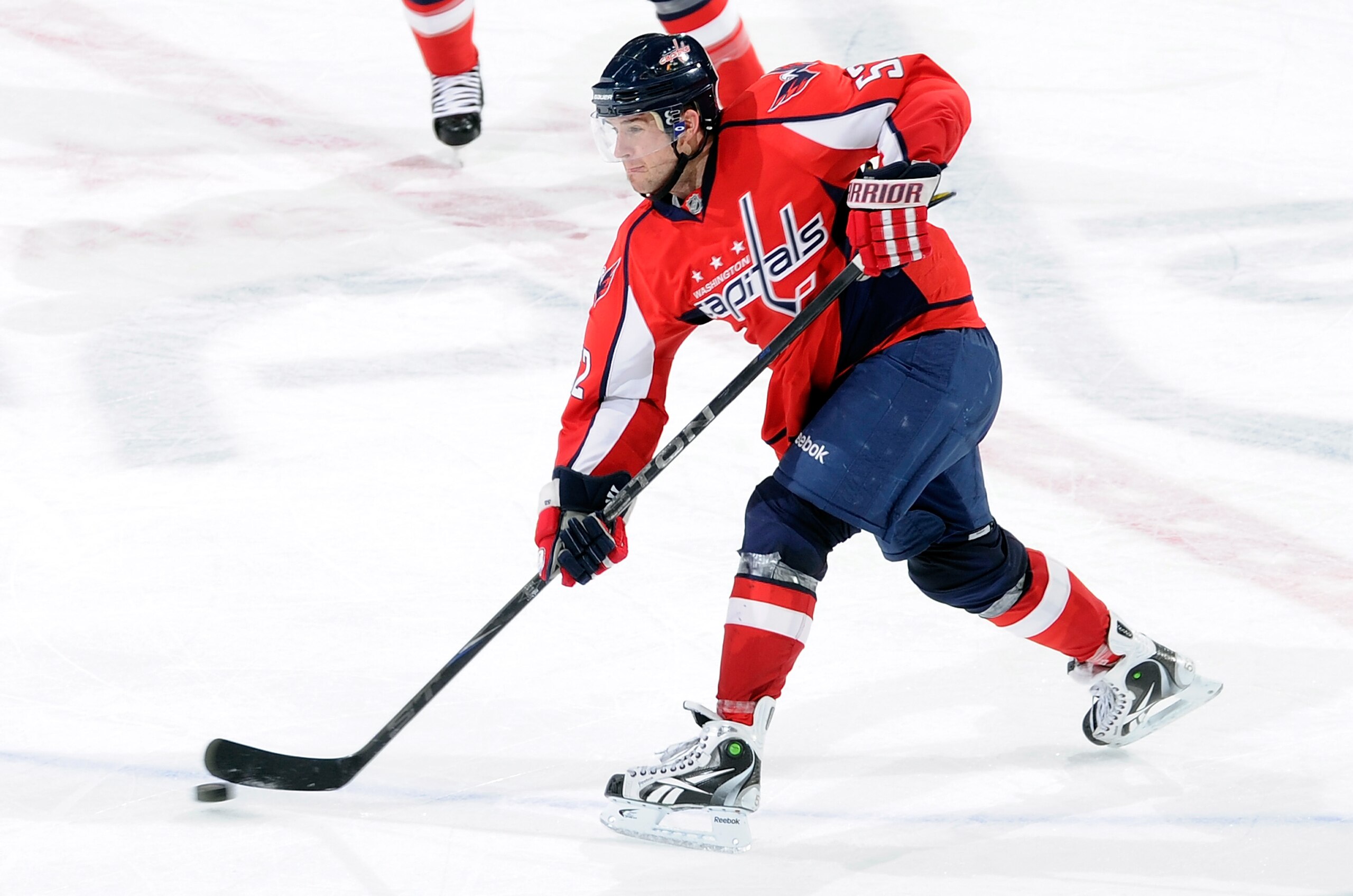 WASHINGTON, DC - DECEMBER 09:  Mike Green #52 of the Washington Capitals shoots the puck down the ice against the Florida Panthers at the Verizon Center on December 9, 2010 in Washington, DC.  (Photo by Greg Fiume/Getty Images)