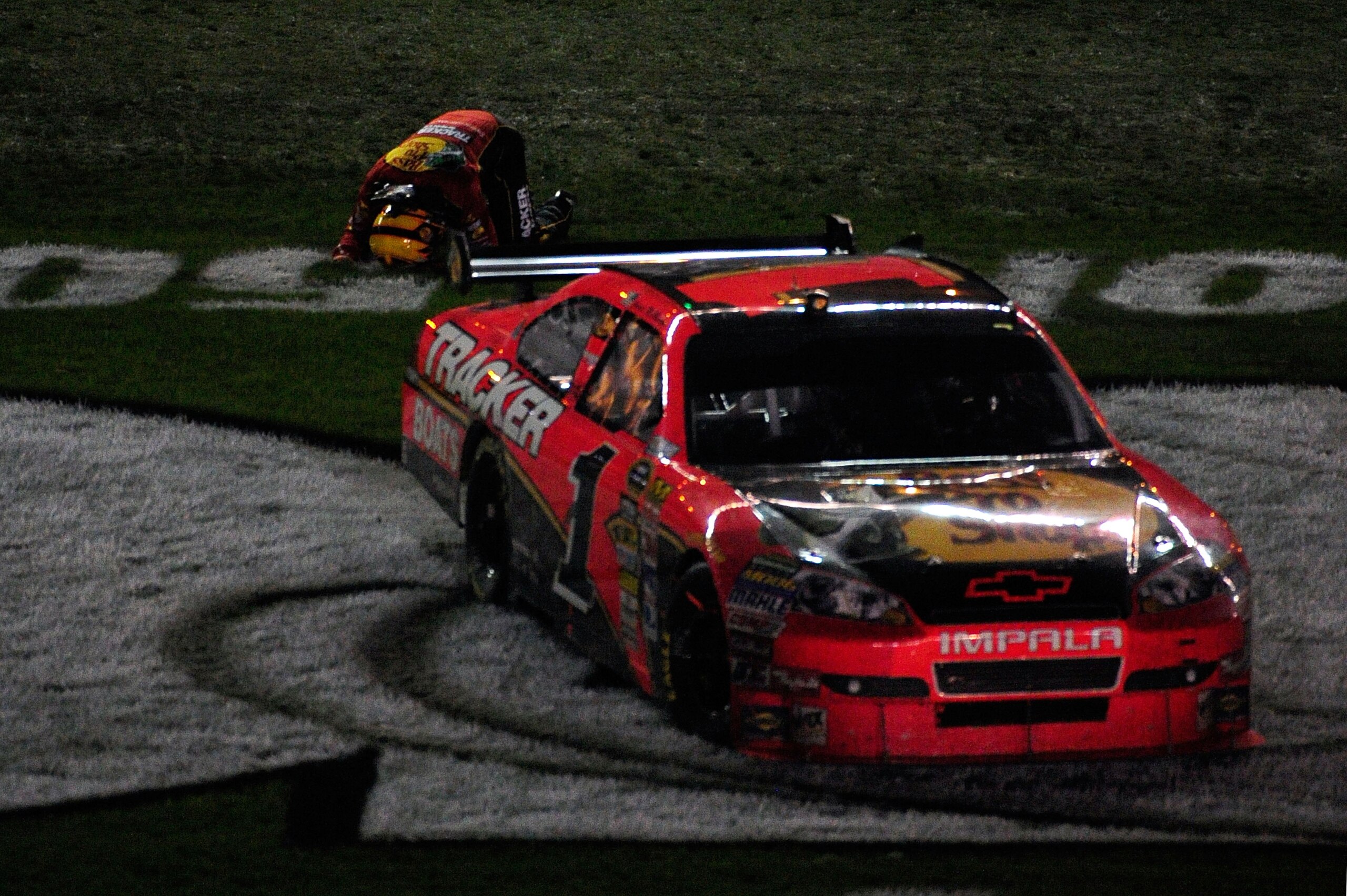DAYTONA BEACH, FL - FEBRUARY 14:  Jamie McMurray climbs on top of his #1 Bass Tracker Chevrolet to celebrate winning the NASCAR Sprint Cup Series Daytona 500 at Daytona International Speedway on February 14, 2010 in Daytona Beach, Florida.  (Photo by Sam