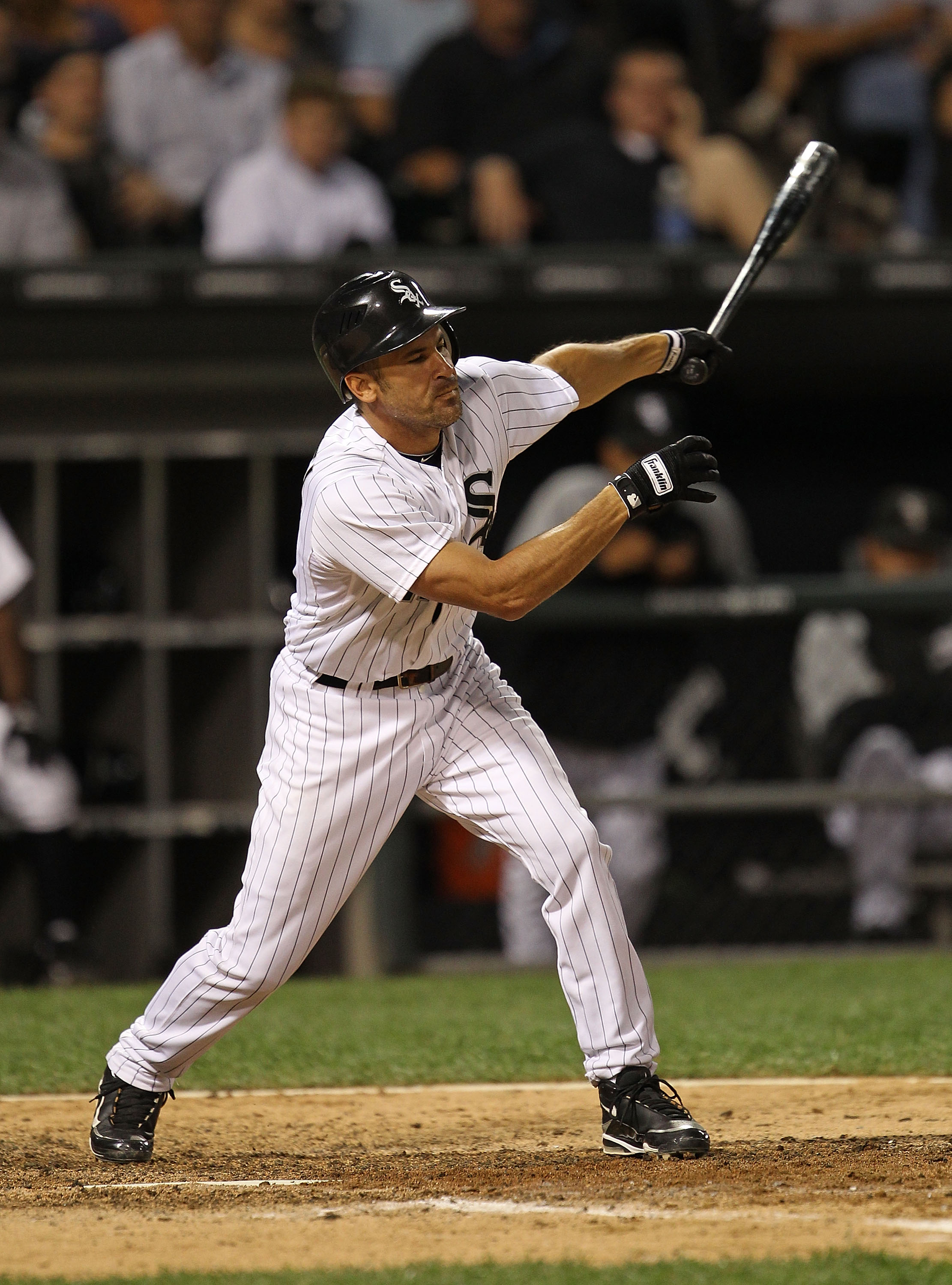 CHICAGO - AUGUST 25: Omar Vizquel #11 of the Chicago White Sox takes a swing against the Baltimore Orioles at U.S. Cellular Field on August 25, 2010 in Chicago, Illinois. The Orioles defeated the White Sox 4-2. (Photo by Jonathan Daniel/Getty Images)