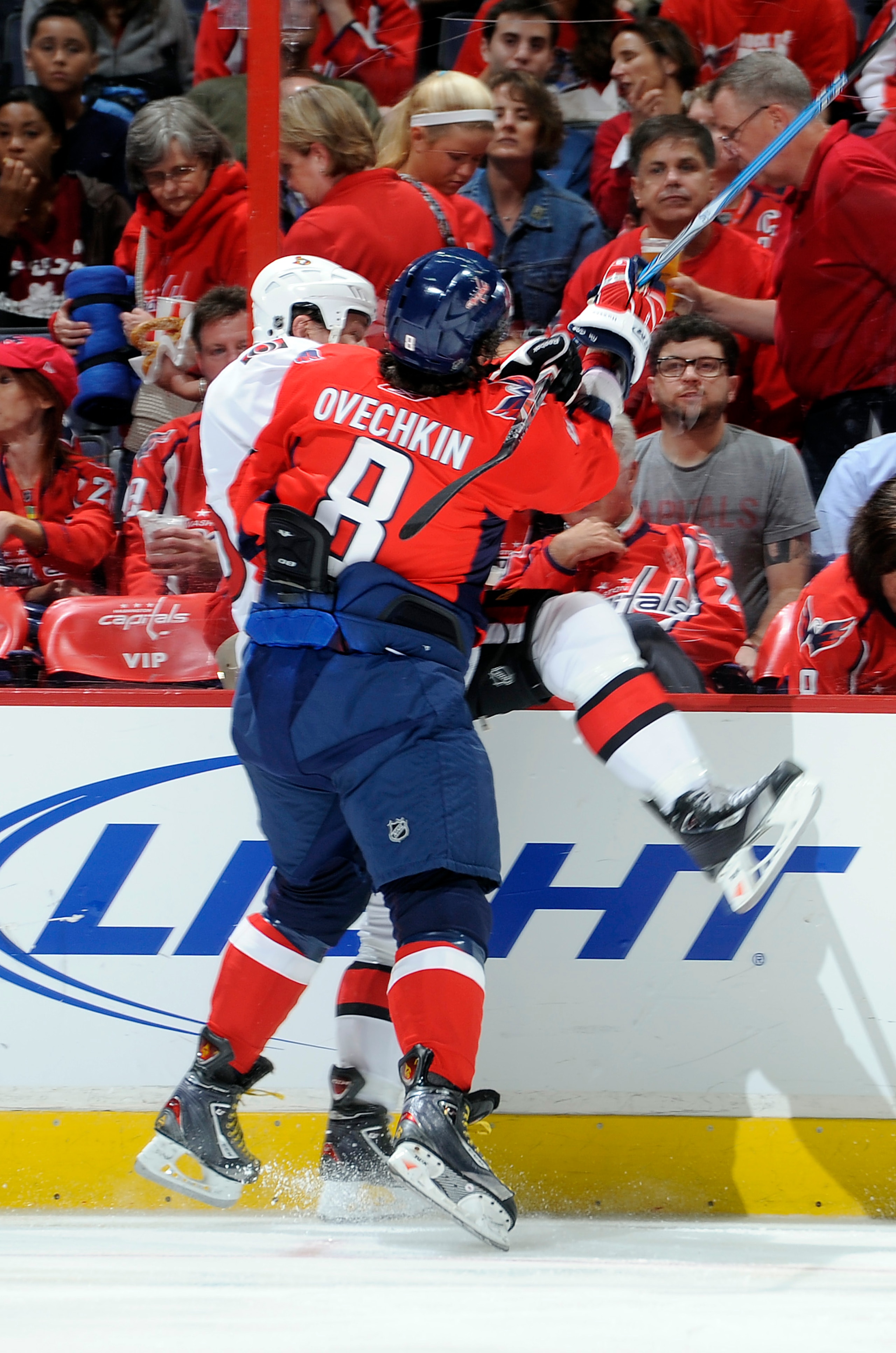 WASHINGTON - OCTOBER 11:  Alex Ovechkin #8 of the Washington Capitals checks Zack Smith #15 of the Ottawa Senators at the Verizon Center on October 11, 2010 in Washington, DC.  (Photo by Greg Fiume/Getty Images)