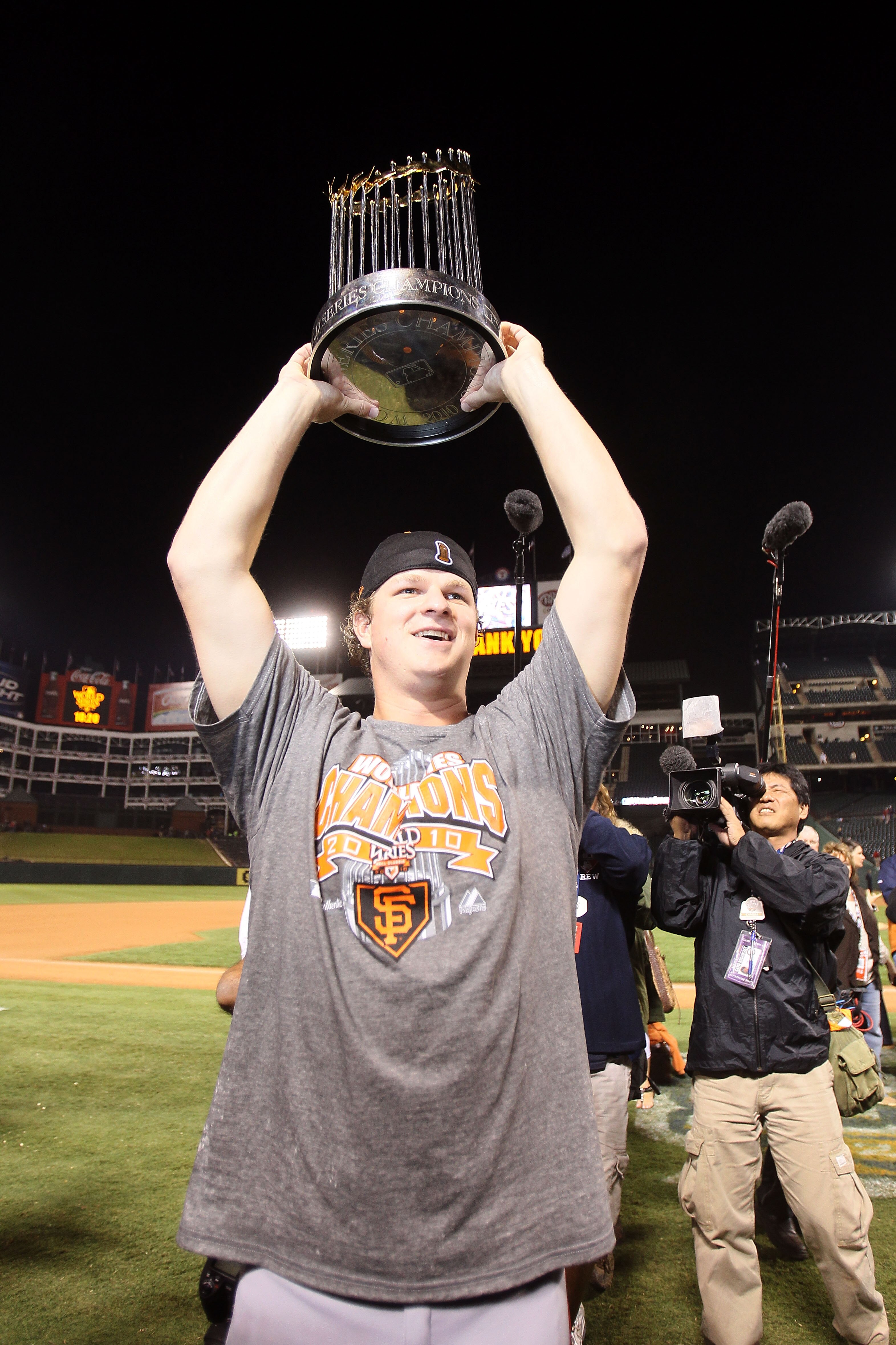 ARLINGTON, TX - NOVEMBER 01:  Matt Cain of the San Francisco Giants celebrates with the World Series Championship trophy out to the field after they won 3-1 against the Texas Rangers in Game Five of the 2010 MLB World Series at Rangers Ballpark in Arlingt