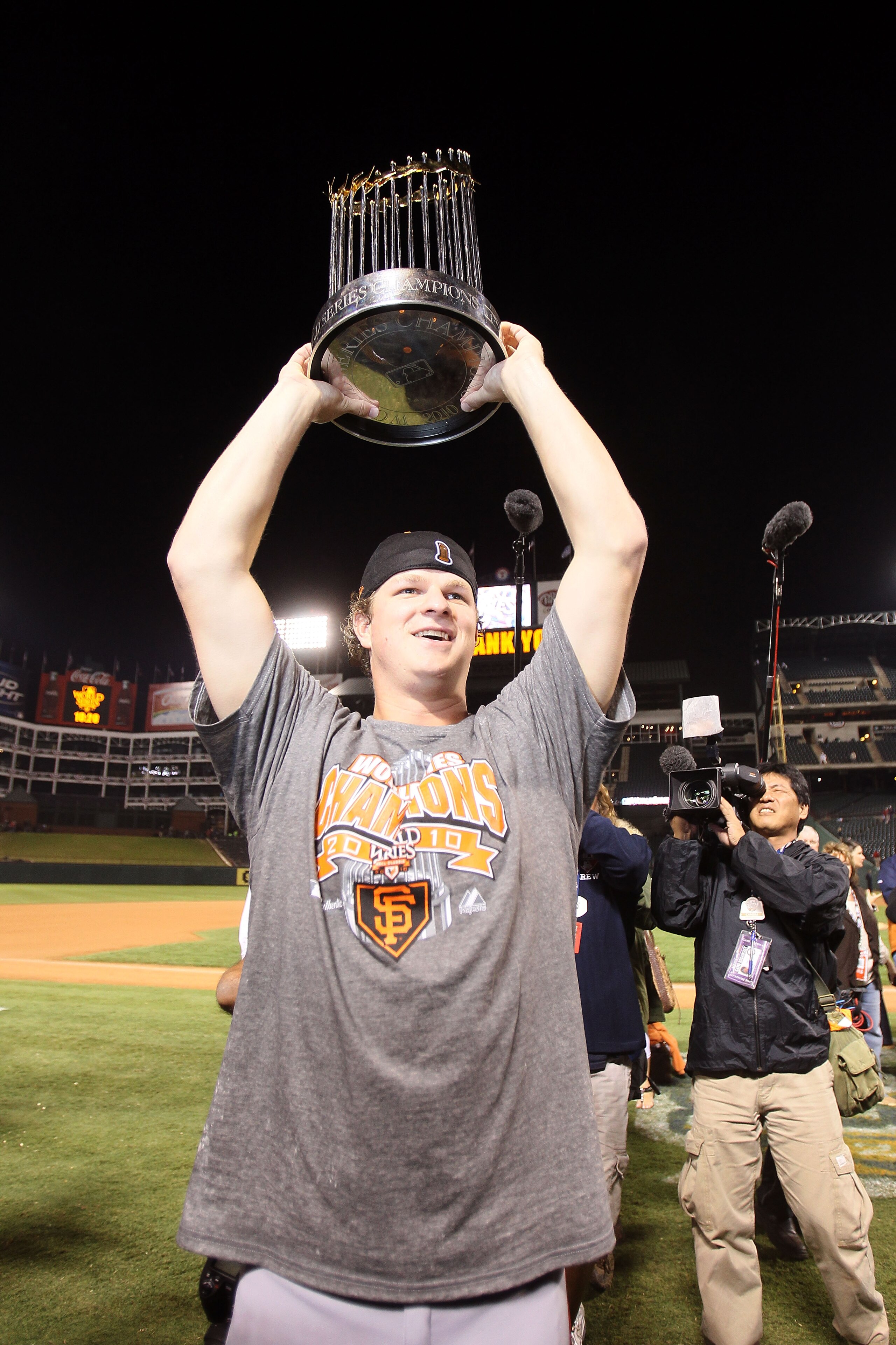 ARLINGTON, TX - NOVEMBER 01:  Matt Cain of the San Francisco Giants celebrates with the World Series Championship trophy out to the field after they won 3-1 against the Texas Rangers in Game Five of the 2010 MLB World Series at Rangers Ballpark in Arlingt