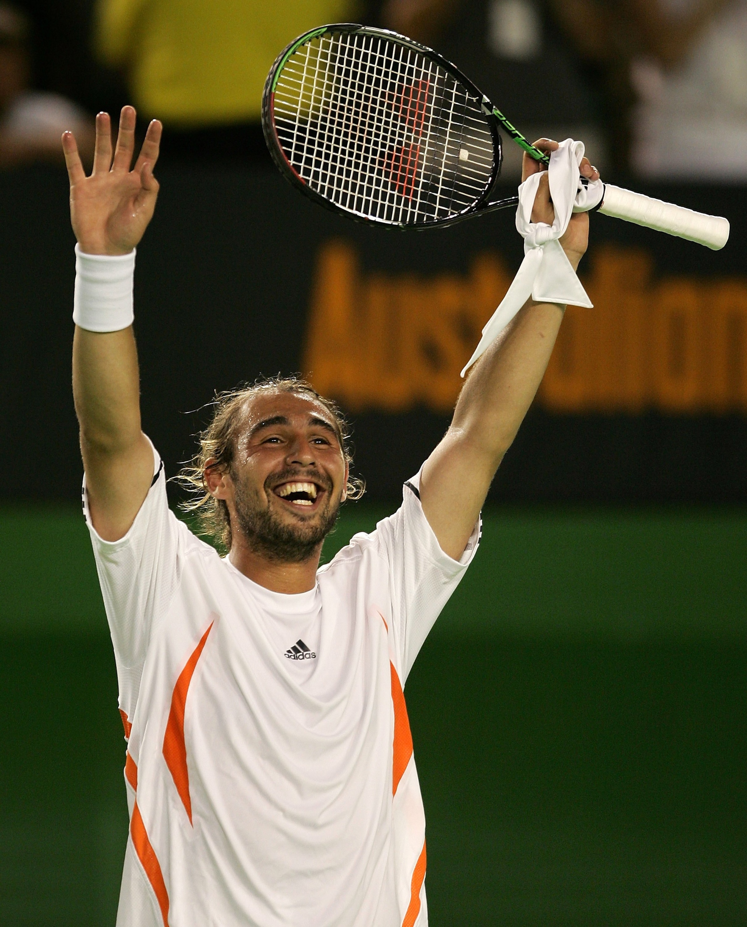 MELBOURNE, AUSTRALIA - JANUARY 22:  Marcos Baghdatis of Cyprus celebrates victory in his fourth round match against Andy Roddick of the USA  during day seven of the Australian Open at Melbourne Park January 22, 2006 in Melbourne, Australia. (Photo by Cliv