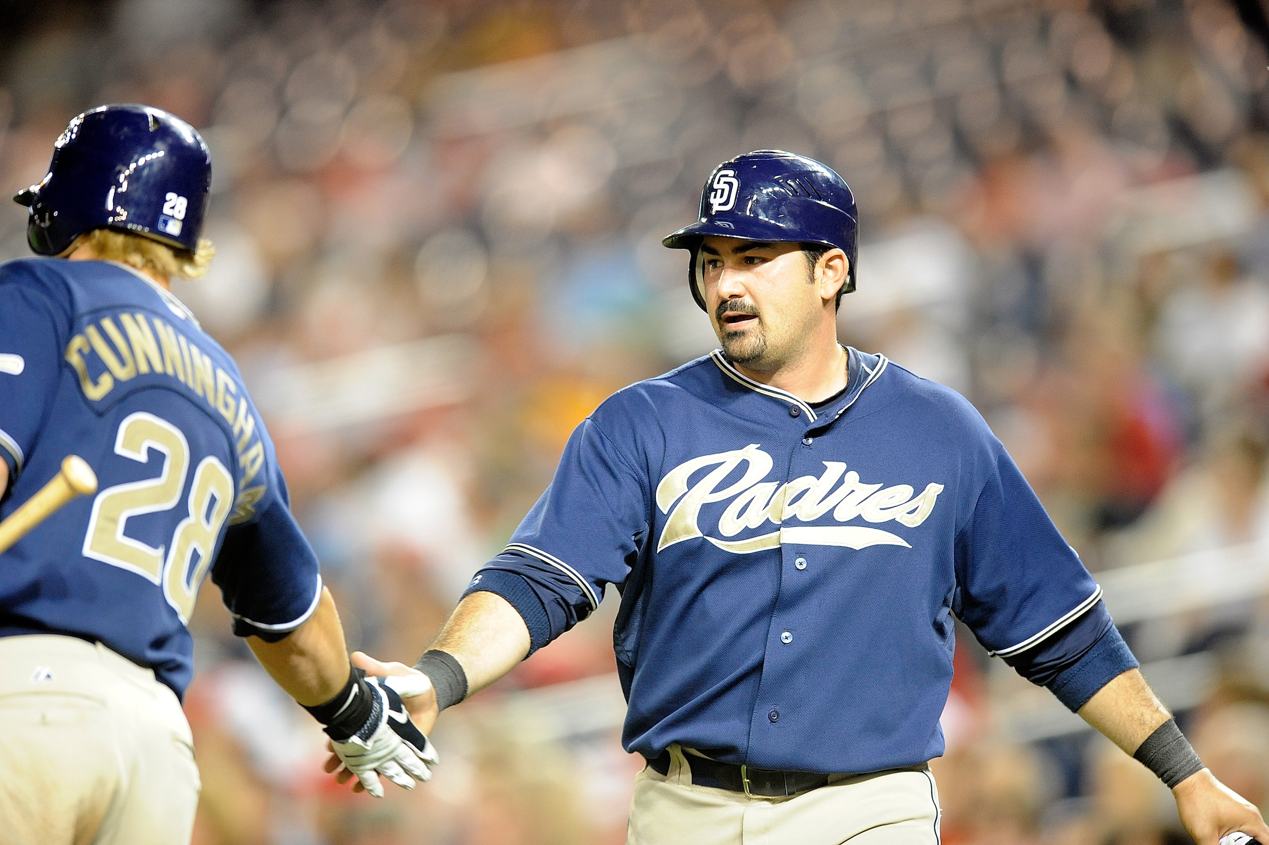 WASHINGTON - JULY 06: Adrian Gonzalez #23 of the San Diego Padres is congratulated by Aaron Cunningham #28 after scoring in the eighth inning against the Washington Nationals at Nationals Park on July 6, 2010 in Washington, DC. (Photo by Greg Fiume/Gett WASHINGTON - JULY 06: Adrian Gonzalez #23 of the San Diego Padres is congratulated by Aaron Cunningham #28 after scoring in the eighth inning against the Washington Nationals at Nationals Park on July 6, 2010 in Washington, DC. (Photo by Greg Fiume/Gett