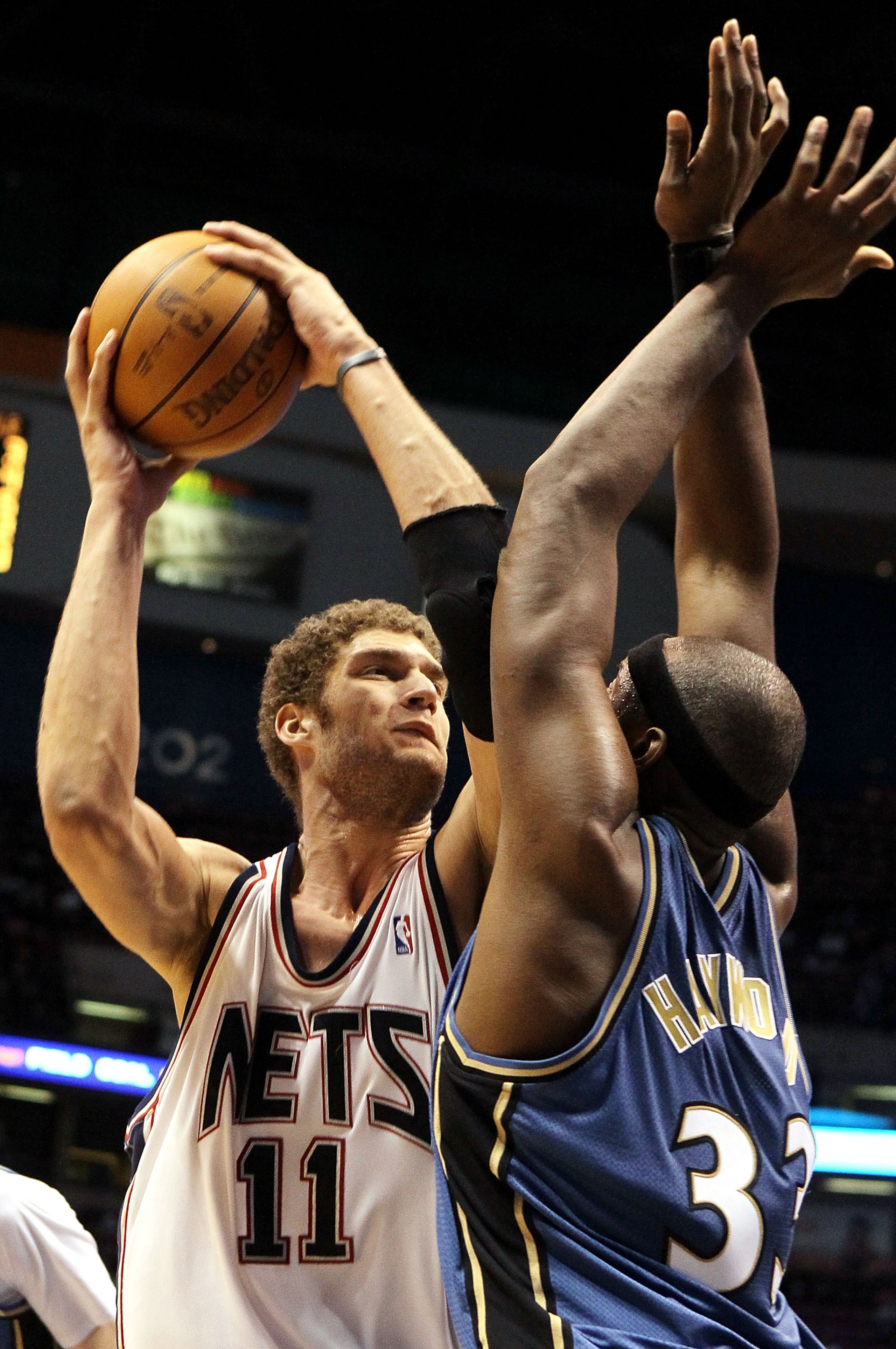 EAST RUTHERFORD, NJ - JANUARY 29: Brook Lopez #11 of the New Jersey Nets takes a shot against Brendan Haywood #33 of the Washington Wizards at the Izod Center on January 29, 2010 in East Rutherford, New Jersey. The Wizards defeated the Nets 81-79.NOTE TO EAST RUTHERFORD, NJ - JANUARY 29: Brook Lopez #11 of the New Jersey Nets takes a shot against Brendan Haywood #33 of the Washington Wizards at the Izod Center on January 29, 2010 in East Rutherford, New Jersey. The Wizards defeated the Nets 81-79.NOTE TO