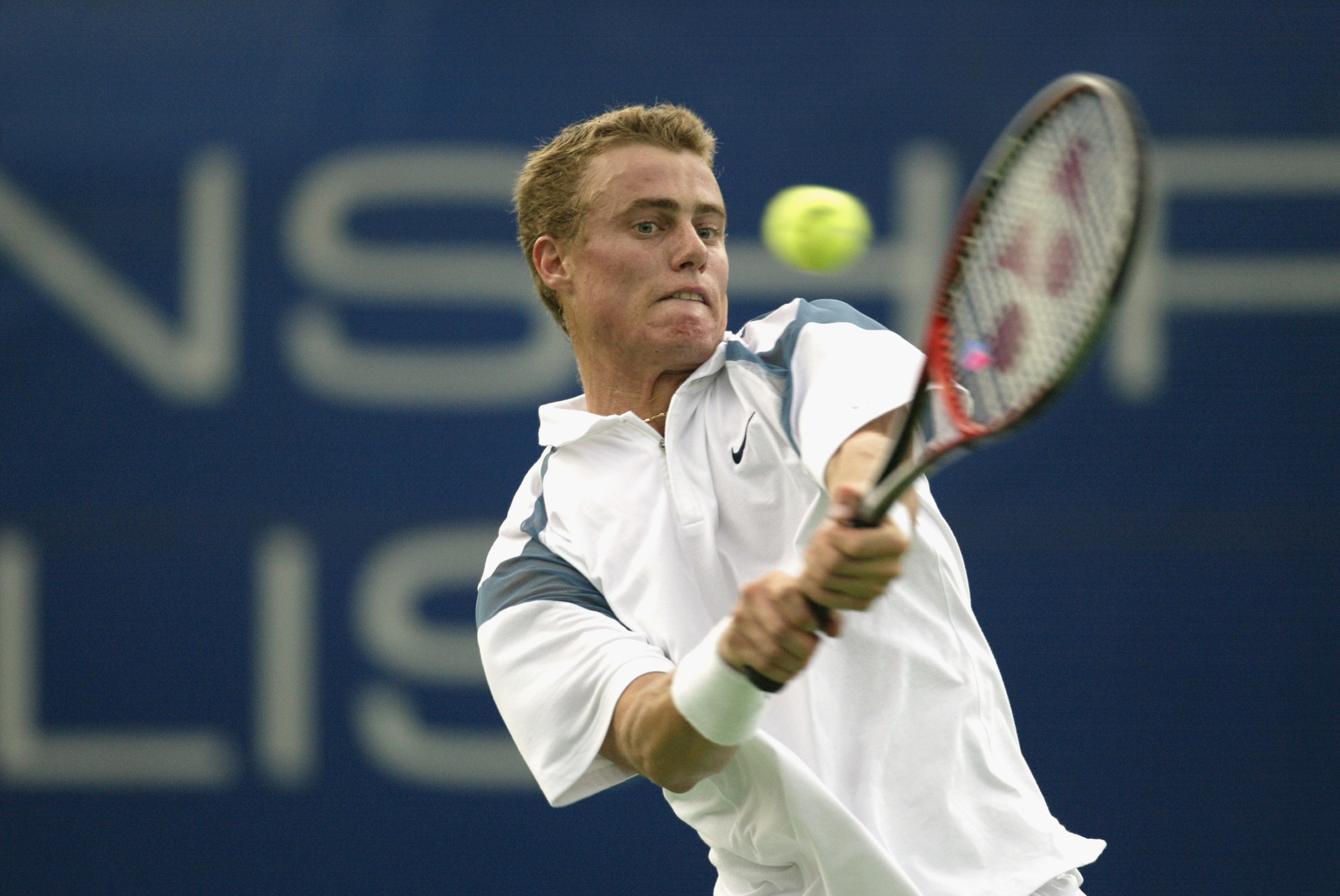 INDIANAPOLIS, IN - AUGUST 14:  Lleyton Hewitt of Australia hits a backhanded return against Alberto Martin of Spain during the second round of the RCA Championships August 14, 2002, at the Indianapolis Tennis Center in Indianapolis, Indiana.    (Photo by