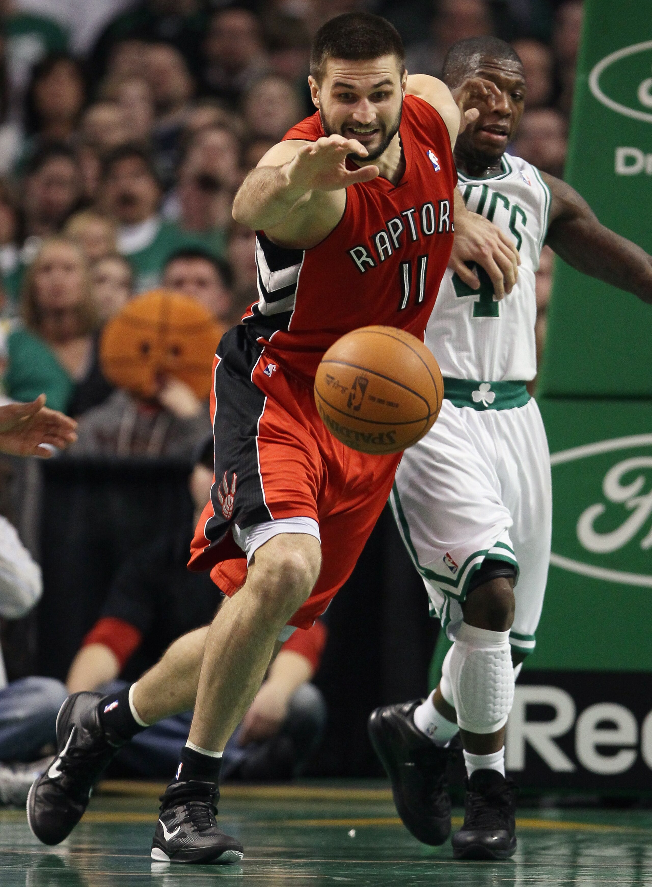 BOSTON, MA - JANUARY 07: Andrea Bargnani #11 of the Toronto Raptors chases after the loose ball as Nate Robinson #4 of the Boston Celtics defends on January 7, 2011 at the TD Garden in Boston, Massachusetts. The Celtics defeated the Raptors 122-102. NOT BOSTON, MA - JANUARY 07: Andrea Bargnani #11 of the Toronto Raptors chases after the loose ball as Nate Robinson #4 of the Boston Celtics defends on January 7, 2011 at the TD Garden in Boston, Massachusetts. The Celtics defeated the Raptors 122-102. NOT