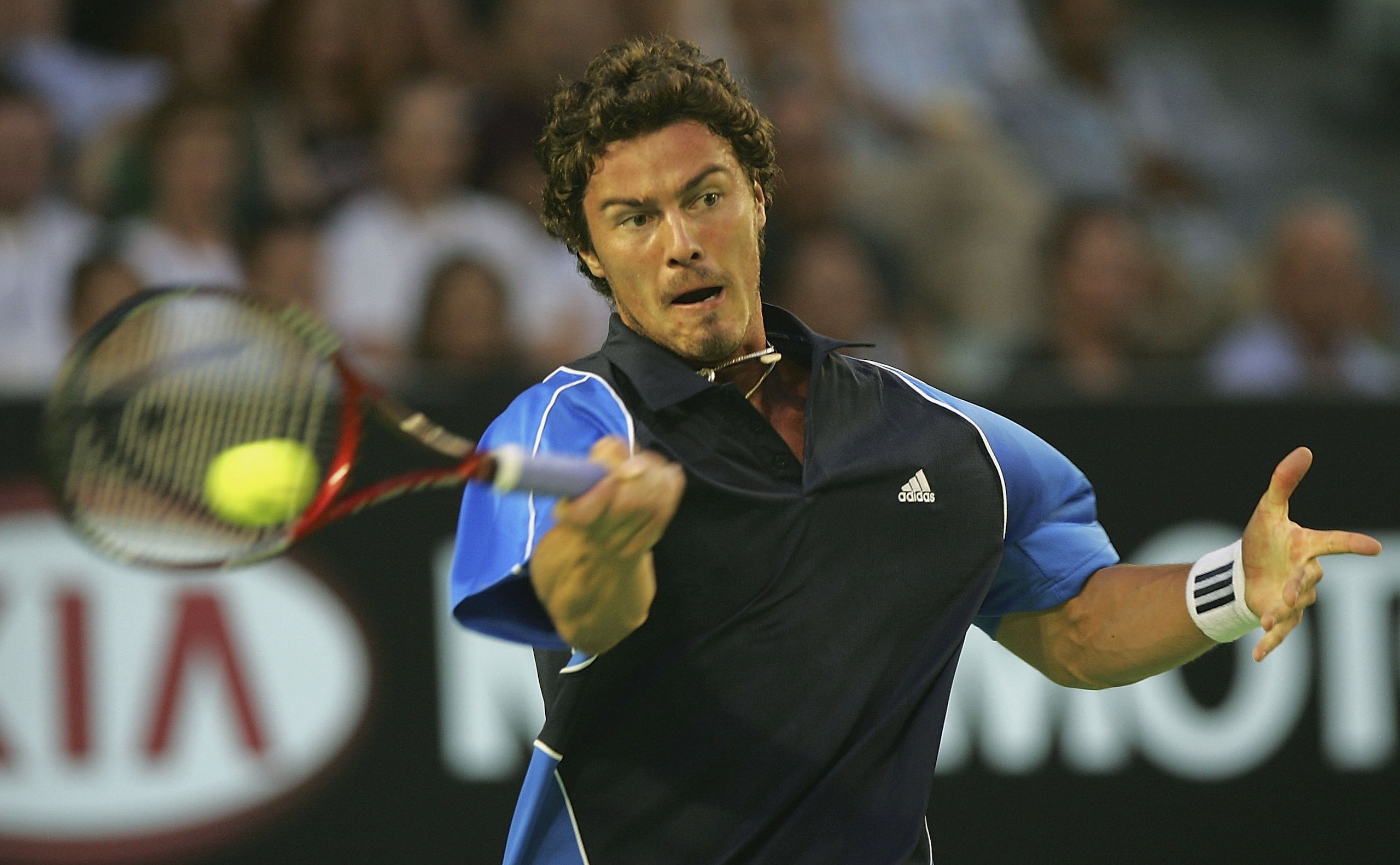 MELBOURNE, AUSTRALIA - JANUARY 27:  Marat Safin of Russia in action against Roger Federer of Switzerland during day eleven of the Australian Open Grand Slam at Melbourne Park January 27, 2005 in Melbourne, Australia. (Photo by Sean Garnsworthy/Getty Image