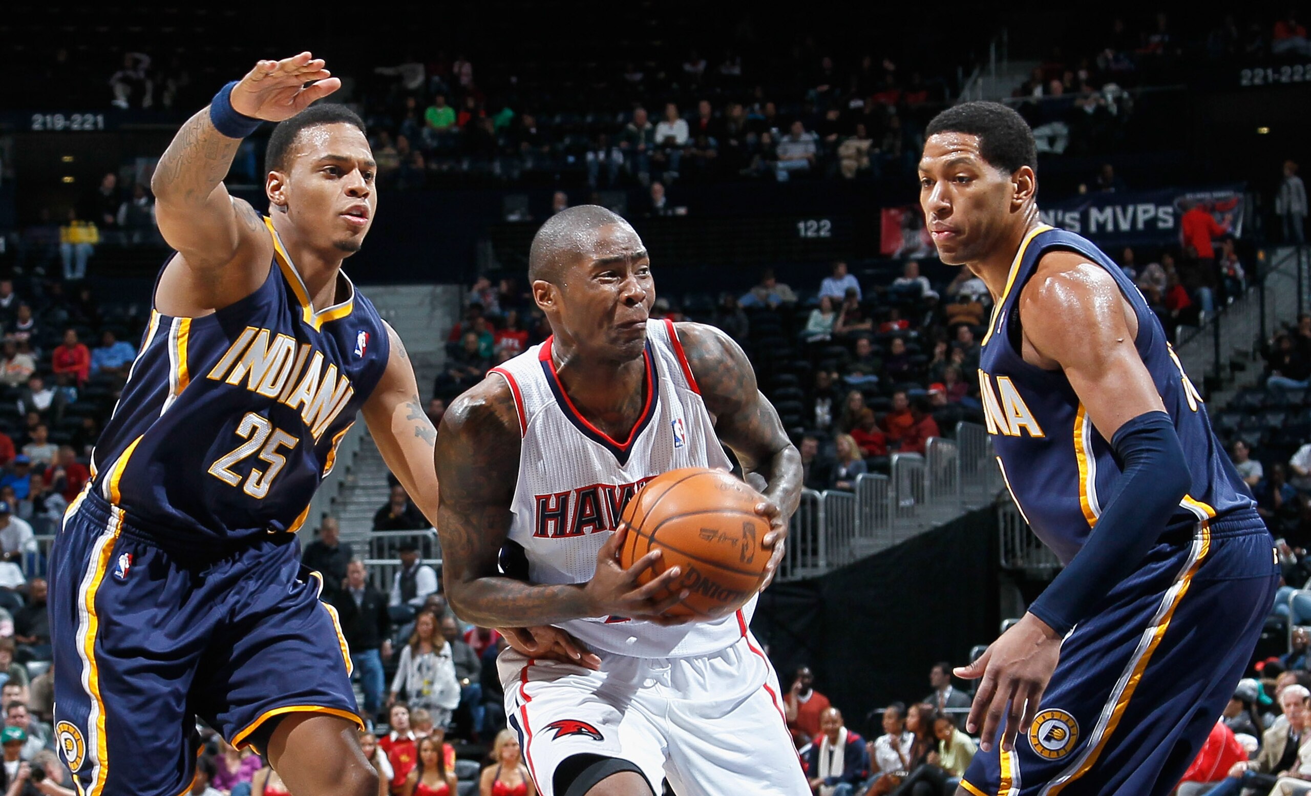 ATLANTA, GA - DECEMBER 11: Jamal Crawford #25 of the Atlanta Hawks against Danny Granger #33 and Brandon Rush #25 of the Indiana Pacers at Philips Arena on December 11, 2010 in Atlanta, Georgia. NOTE TO USER: User expressly acknowledges and agrees that, ATLANTA, GA - DECEMBER 11: Jamal Crawford #25 of the Atlanta Hawks against Danny Granger #33 and Brandon Rush #25 of the Indiana Pacers at Philips Arena on December 11, 2010 in Atlanta, Georgia. NOTE TO USER: User expressly acknowledges and agrees that,