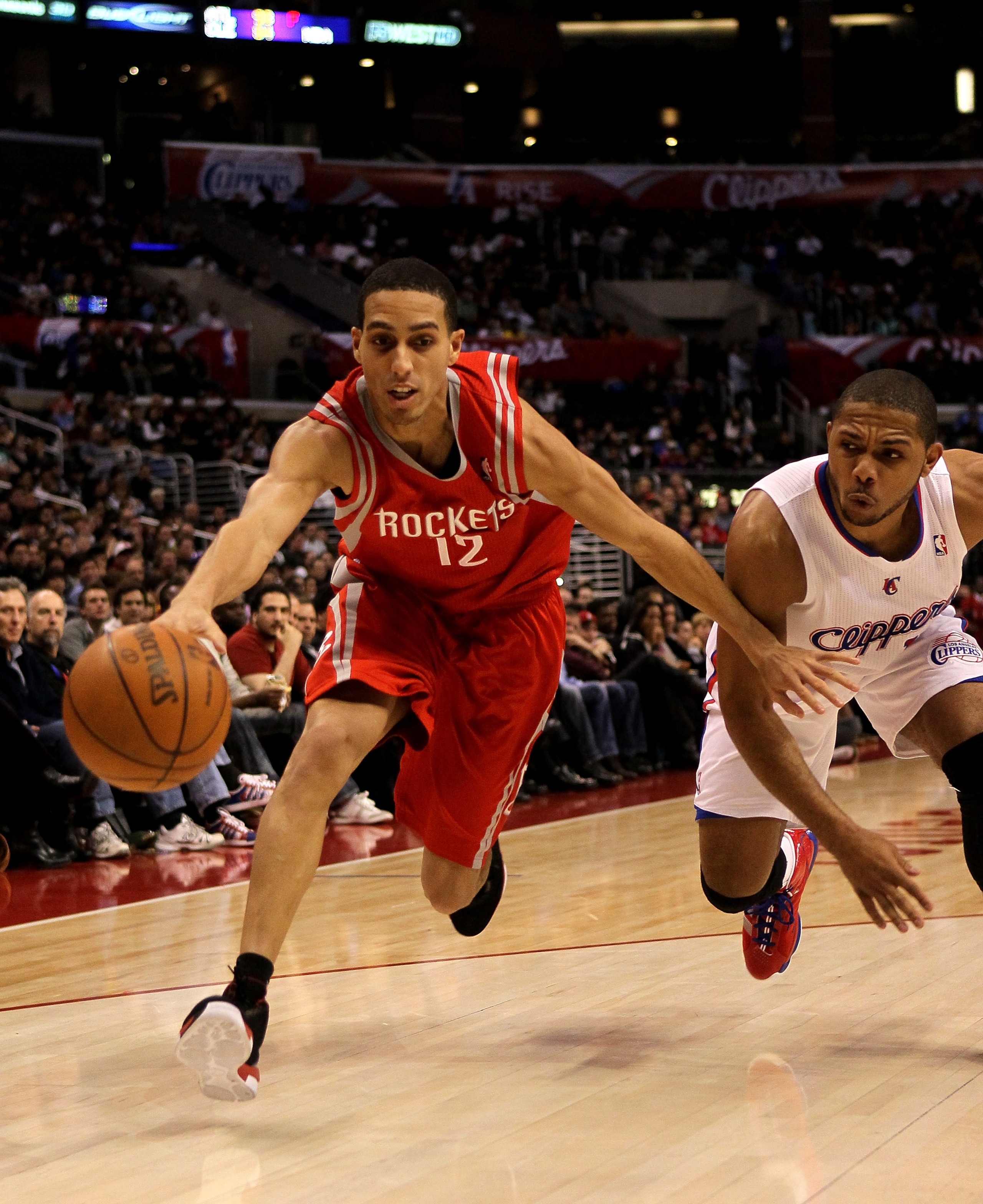 LOS ANGELES, CA - DECEMBER 22: Kevin Martin #12 of the Houston Rockets reaches to control the ball in front of Eric Gordon #10 of the Los Angeles Clippers at Staples Center on December 22, 2010 in Los Angeles, California. NOTE TO USER: User expressly ac LOS ANGELES, CA - DECEMBER 22: Kevin Martin #12 of the Houston Rockets reaches to control the ball in front of Eric Gordon #10 of the Los Angeles Clippers at Staples Center on December 22, 2010 in Los Angeles, California. NOTE TO USER: User expressly ac