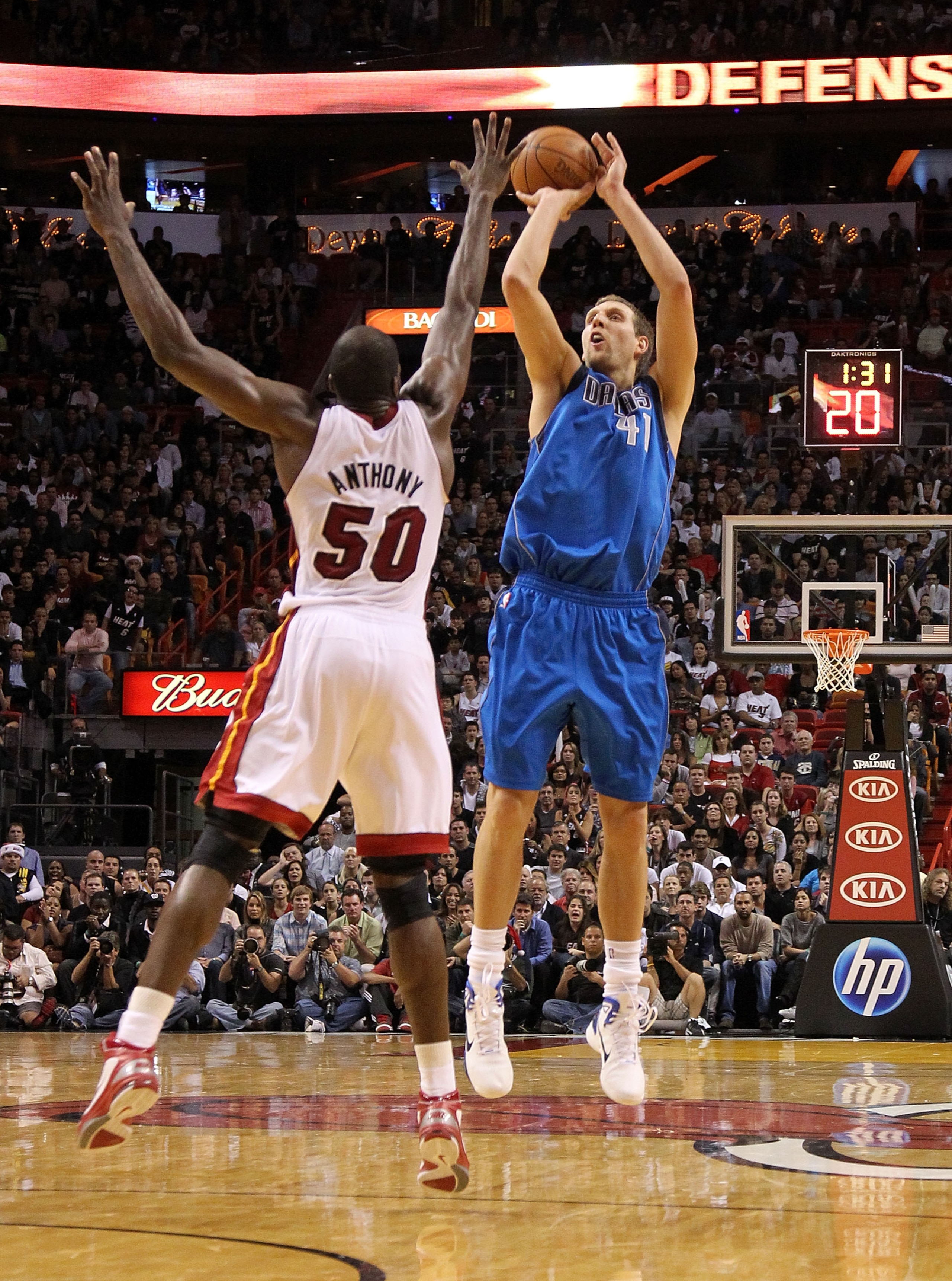 MIAMI, FL - DECEMBER 20: Dirk Nowitzki #41 of the Dallas Mavericks shoots over Joel Anthony #50 of the Miami Heat during a game at American Airlines Arena on December 20, 2010 in Miami, Florida. NOTE TO USER: User expressly acknowledges and agrees that, MIAMI, FL - DECEMBER 20: Dirk Nowitzki #41 of the Dallas Mavericks shoots over Joel Anthony #50 of the Miami Heat during a game at American Airlines Arena on December 20, 2010 in Miami, Florida. NOTE TO USER: User expressly acknowledges and agrees that,