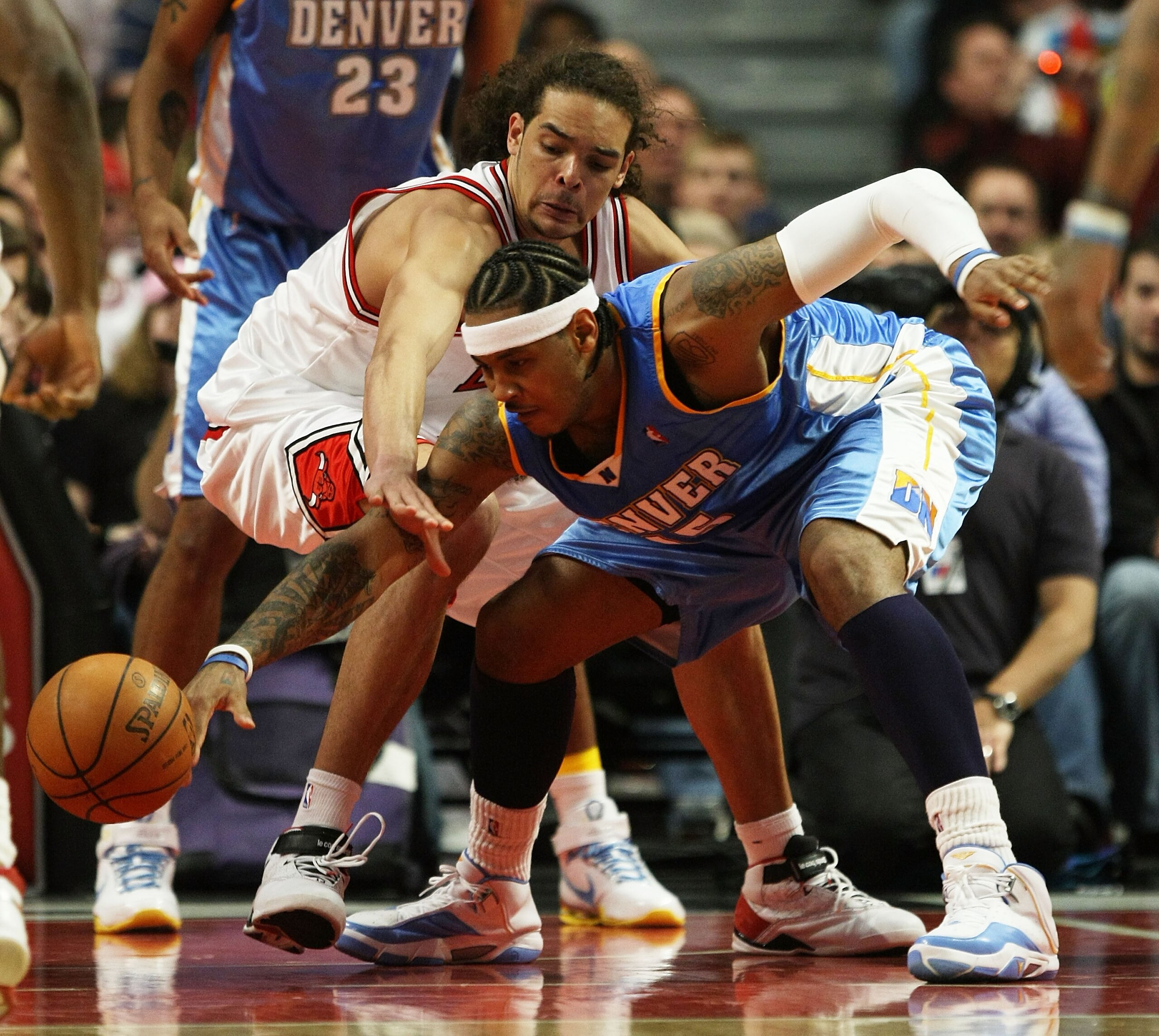 CHICAGO - FEBRUARY 22: Joakim Noah #13 of the Chicago Bulls battles for a loose ball with Carmelo Anthony #15 of the Denver Nuggets on February 22, 2008 at the United Center in Chicago, Illinois. NOTE TO USER: User expressly acknowledges and agreees that, CHICAGO - FEBRUARY 22: Joakim Noah #13 of the Chicago Bulls battles for a loose ball with Carmelo Anthony #15 of the Denver Nuggets on February 22, 2008 at the United Center in Chicago, Illinois. NOTE TO USER: User expressly acknowledges and agreees that,