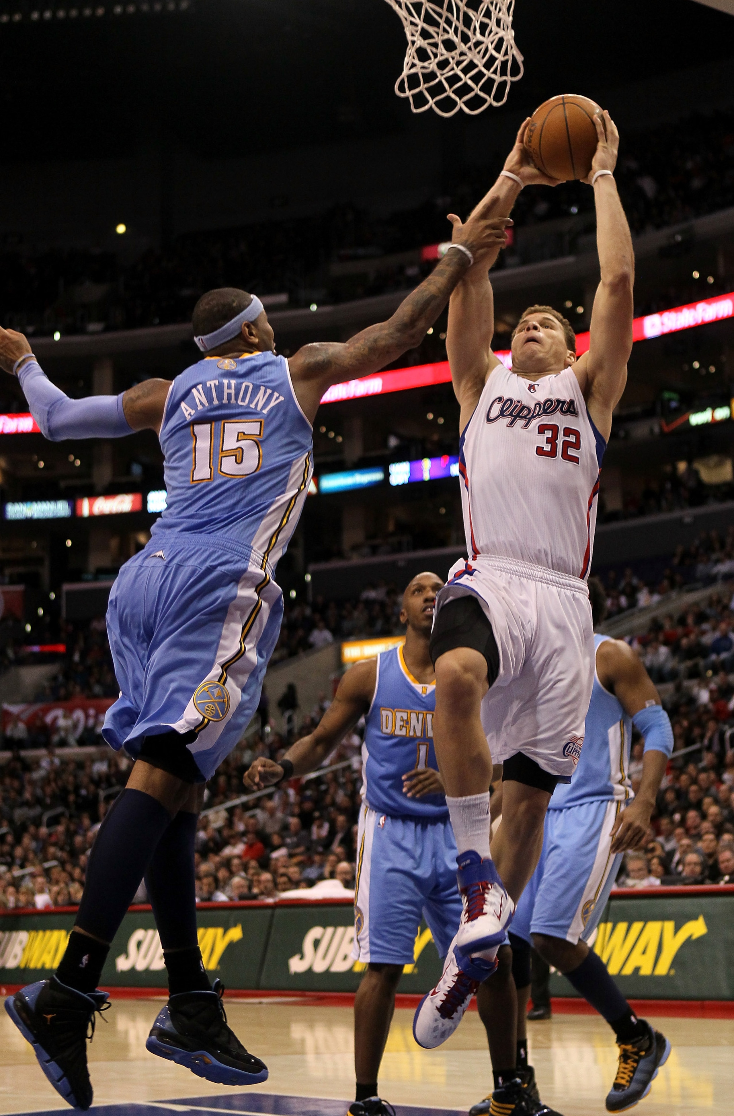 LOS ANGELES, CA - JANUARY 5: Blake Griffin #32 of the Los Angeles Clippers goes up for a shot over Carmelo Anthony #15 of the Denver Nuggets at Staples Center on January 5, 2011 in Los Angeles, California. The Clippers won 106-93. NOTE TO USER: User ex LOS ANGELES, CA - JANUARY 5: Blake Griffin #32 of the Los Angeles Clippers goes up for a shot over Carmelo Anthony #15 of the Denver Nuggets at Staples Center on January 5, 2011 in Los Angeles, California. The Clippers won 106-93. NOTE TO USER: User ex