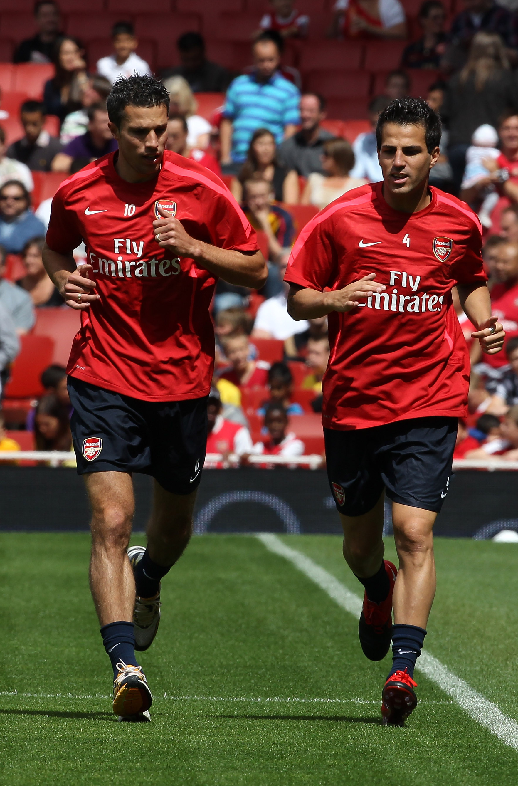 LONDON, ENGLAND - AUGUST 05:  Cesc Fabregas (r) and Robin van Persie attend an Arsenal open training session at Emirates Stadium on August 5, 2010 in London, England.  (Photo by Bryn Lennon/Getty Images)