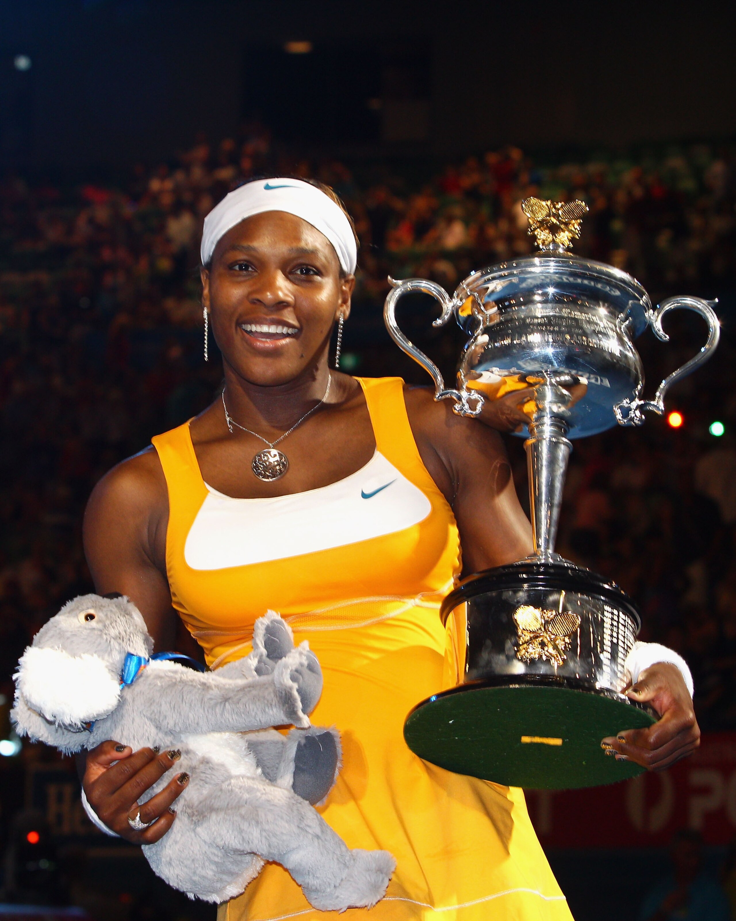 MELBOURNE, AUSTRALIA - JANUARY 30:  Serena Williams of the United States of America poses with the Daphne Akhurst Trophy after winning her women's final match against Justine Henin of Belgium during day thirteen of the 2010 Australian Open at Melbourne Pa