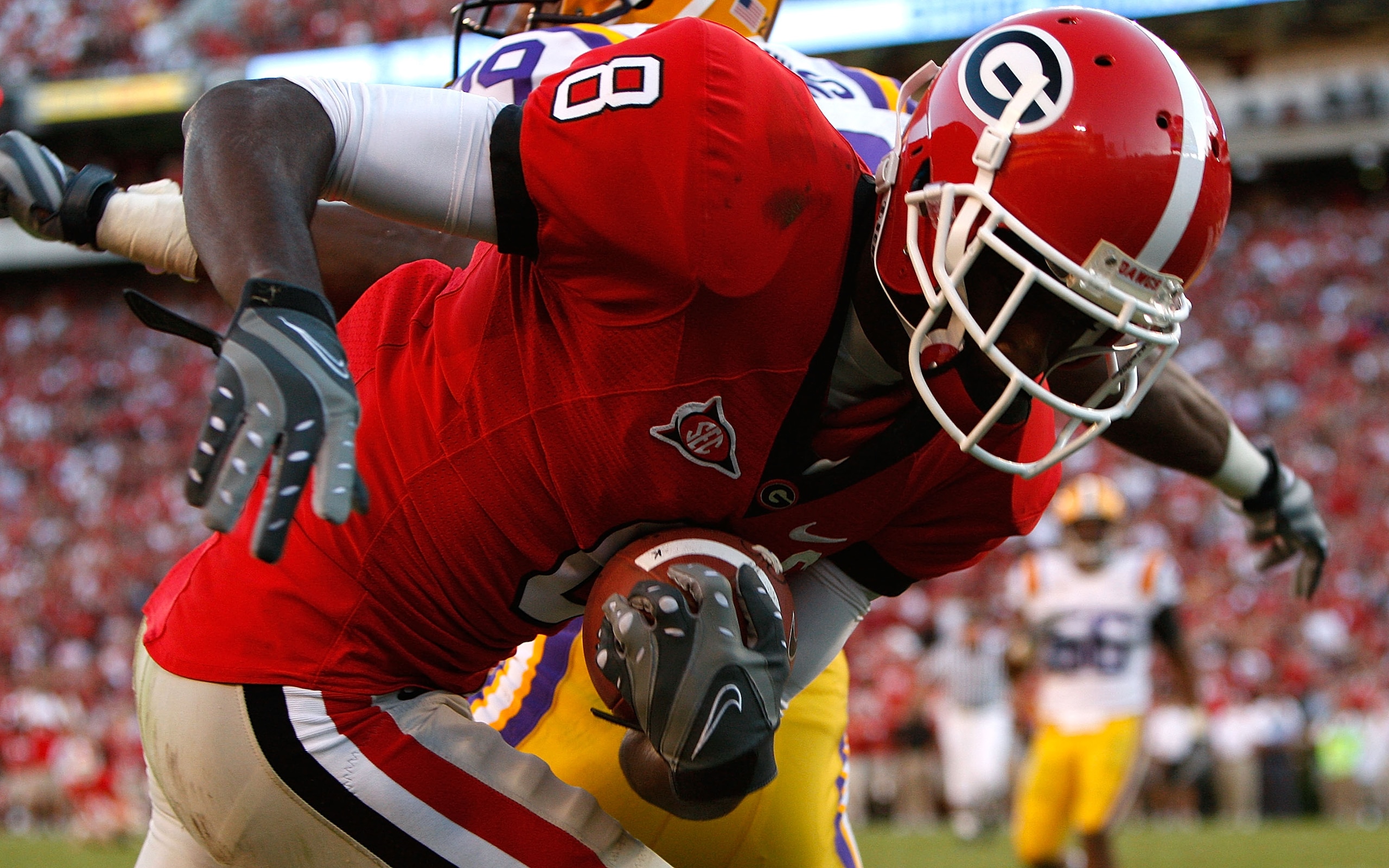 ATHENS, GA - OCTOBER 03: A.J. Green #8 of the Georgia Bulldogs pulls in a touchdown reception against Chris Hawkins #29 of the Louisiana State University Tigers at Sanford Stadium on October 3, 2009 in Athens, Georgia. (Photo by Kevin C. Cox/Getty Images) ATHENS, GA - OCTOBER 03: A.J. Green #8 of the Georgia Bulldogs pulls in a touchdown reception against Chris Hawkins #29 of the Louisiana State University Tigers at Sanford Stadium on October 3, 2009 in Athens, Georgia. (Photo by Kevin C. Cox/Getty Images)