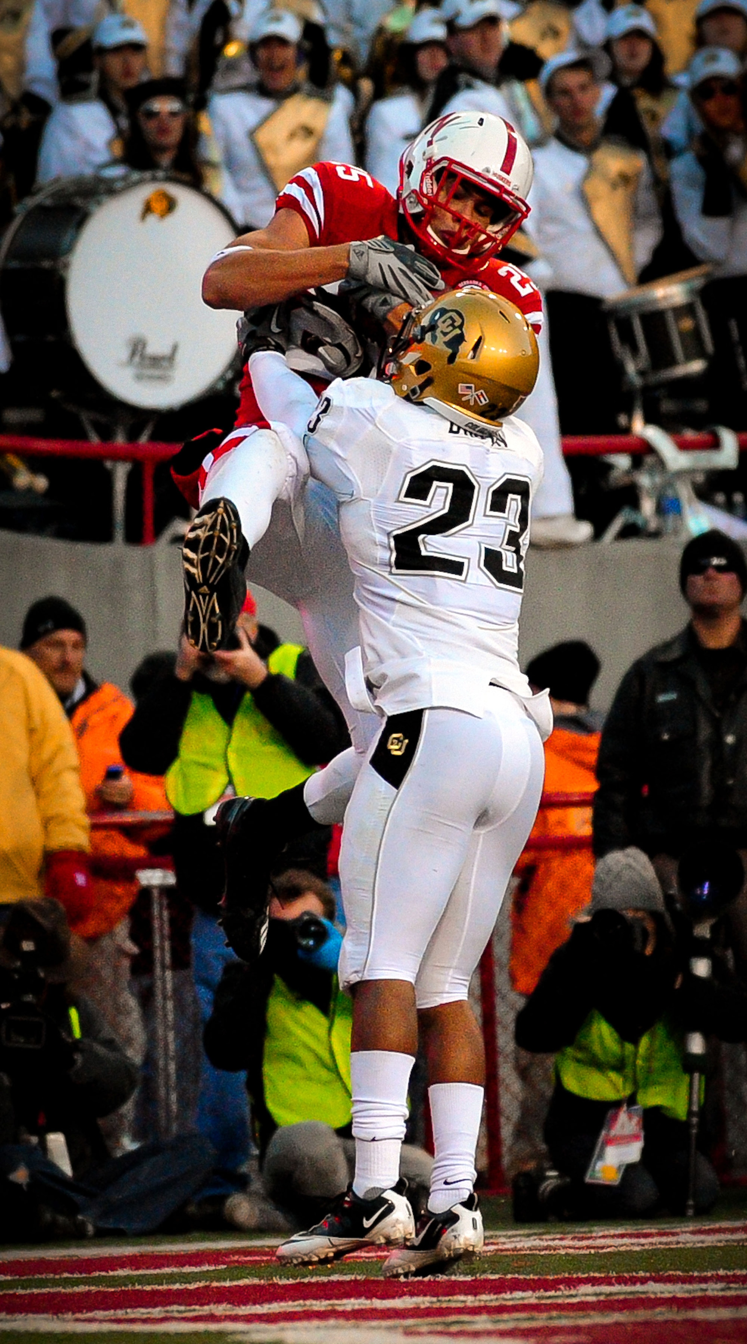 LINCOLN, NE - NOVEMBER 26: Kyler Reed #25 of the Nebraska Cornhuskers catches a touchdown over Jalil Brown #23 of the Colorado Buffaloes during the second half of their game at Memorial Stadium on November 26, 2010 in Lincoln, Nebraska. Nebraska defeated