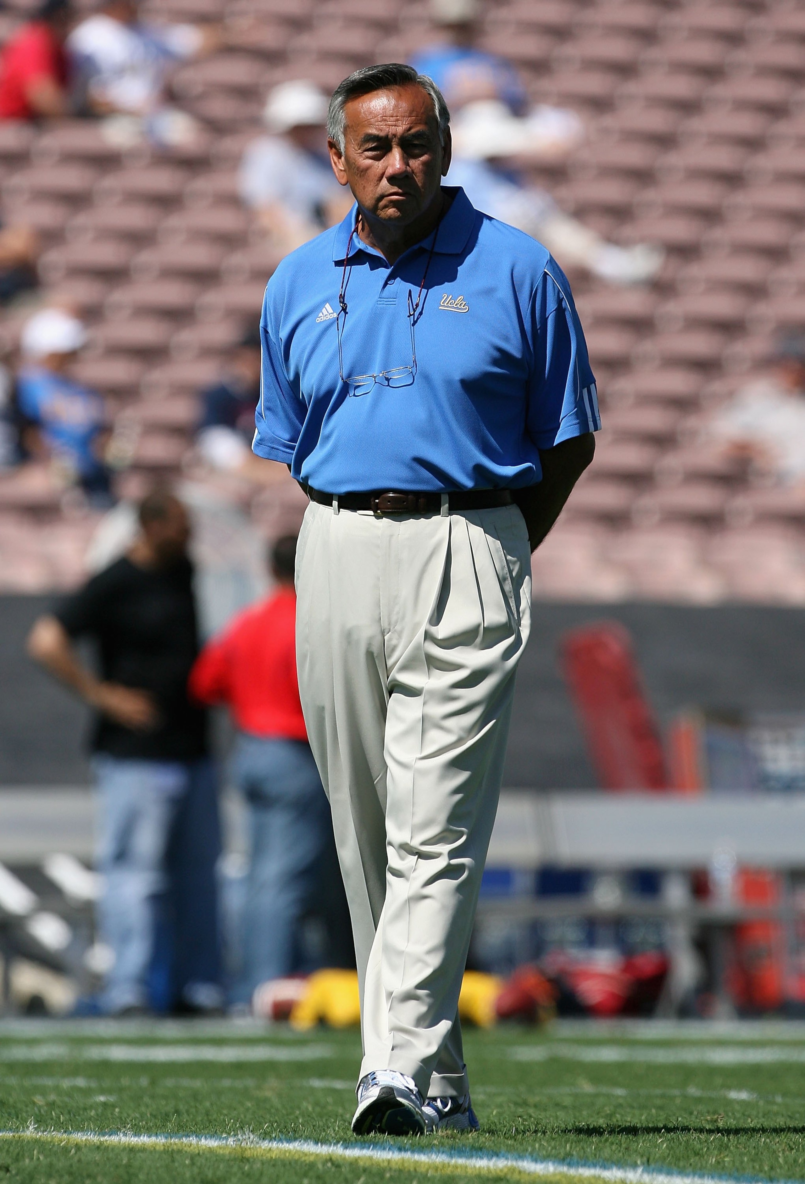 PASADENA, CA - SEPTEMBER 20:  Offensive Coordinatorm Norm Chow of the UCLA Bruins watches warm ups before the college football game against the Arizona Wildcats at the Rose Bowl on September 13, 2008 in Pasadena, California. The Wildcats defeated the Brui