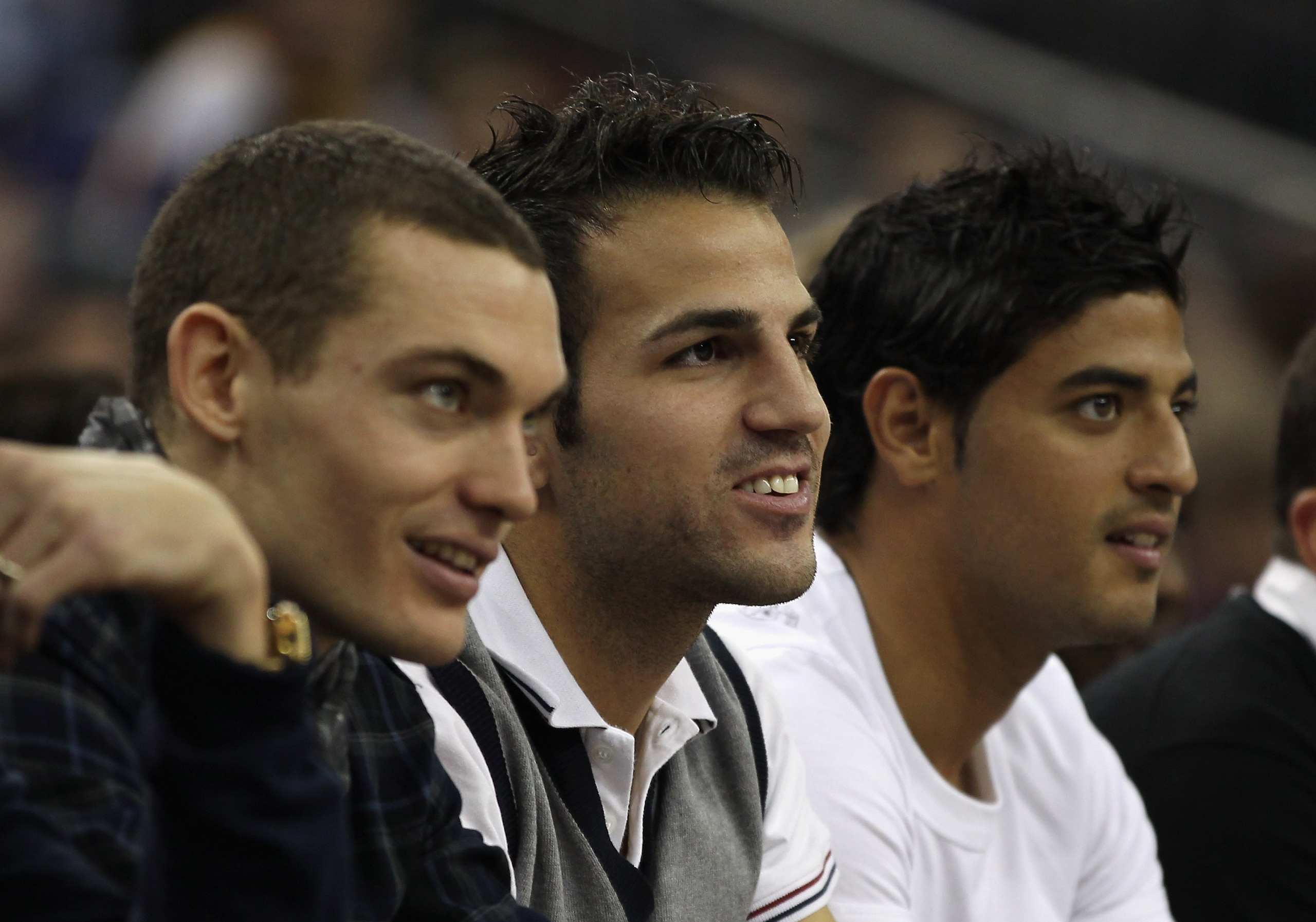LONDON, ENGLAND - OCTOBER 04:  Arsenal footballers (L-R) Thomas Vermaelen, Francesc Fabregas and Carlos Vela during the NBA Europe Live match between the Los Angeles Lakers and the Minnesota Timberwolves at the O2 arena on October 4, 2010 in London, Engla