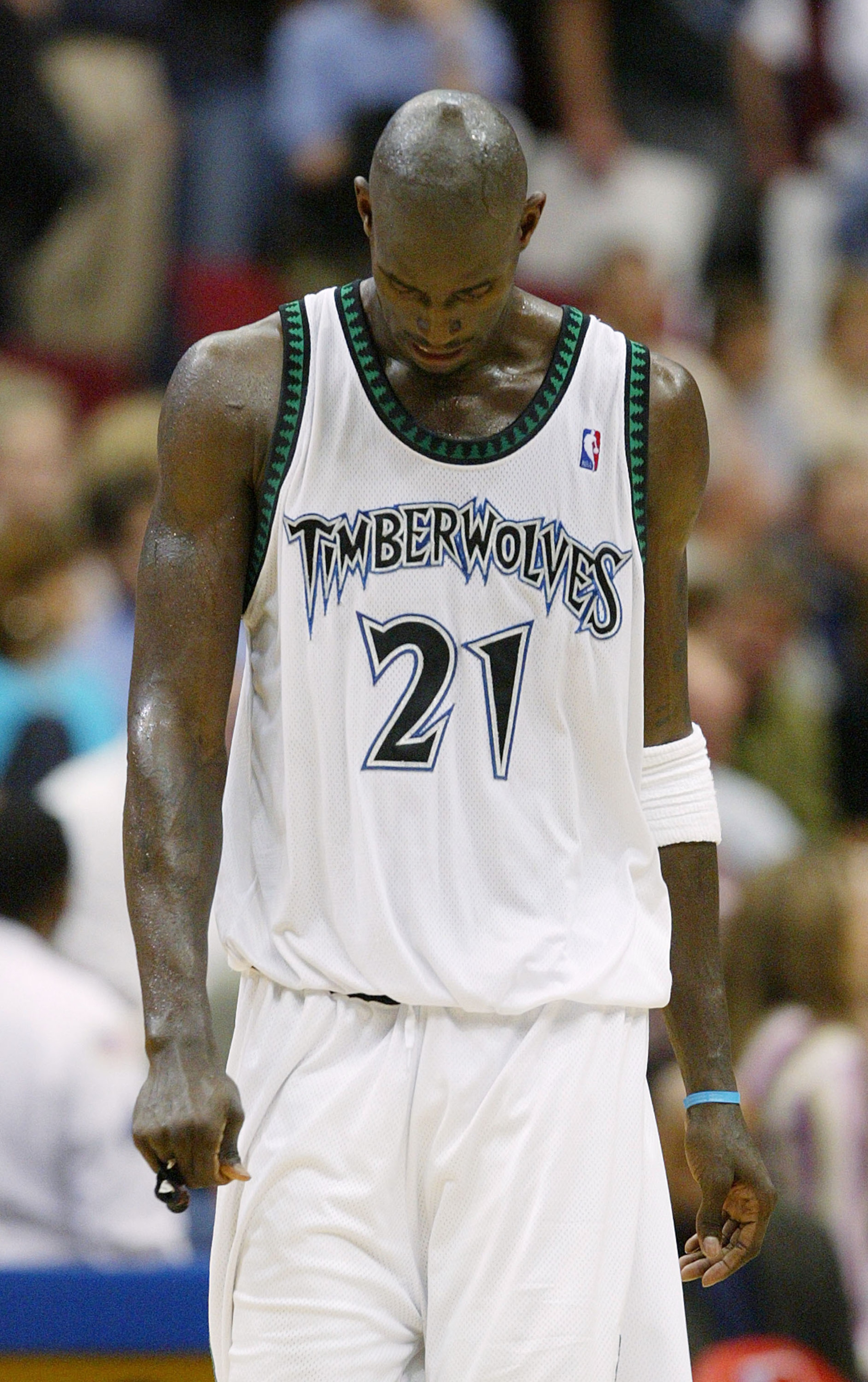 MINNEAPOLIS, MN - MAY 21:  Kevin Garnett #21 of the Minnesota Timberwolves hangs his head in the second half of Game 1 of the Western Conference Finals against the Los Angeles Lakers during the 2004 NBA Playoffs on May 21, 2004 at Target Center in Minneap