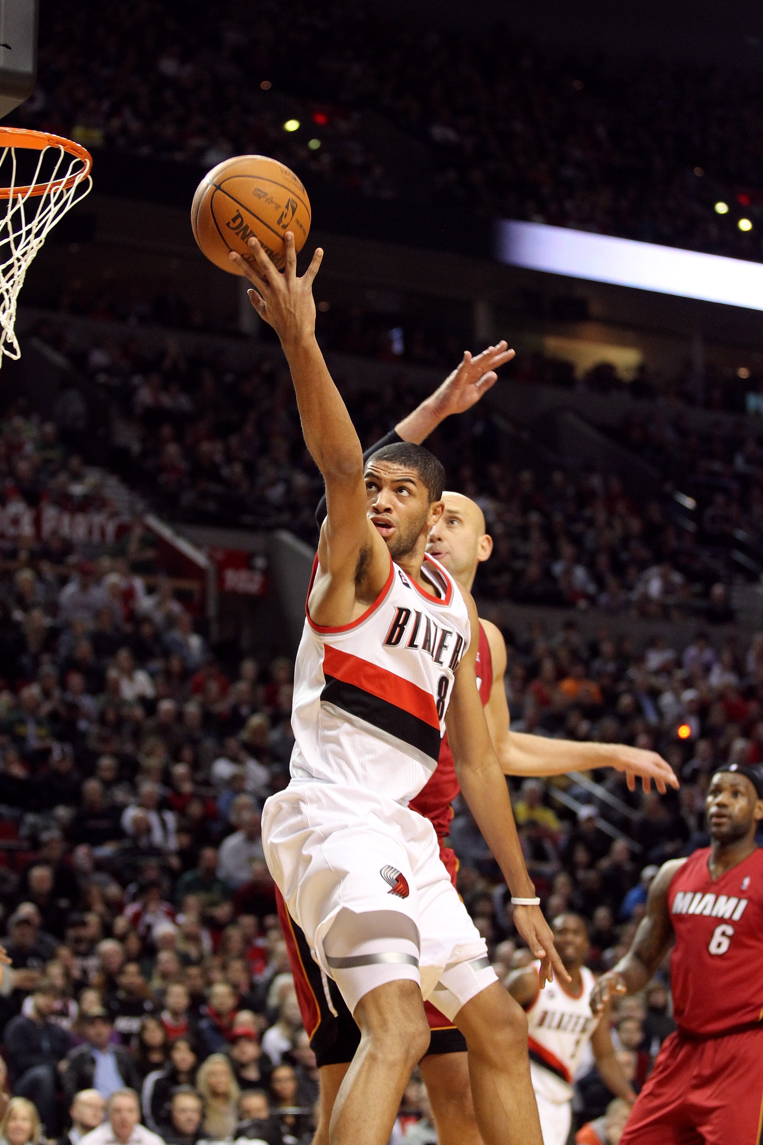 PORTLAND, OR - JANUARY 09: Nicolas Batum #88 of the Portland Trail Blazers lays it up over Zydrunas Ilgauskas #11 of the Miami Heat during a game on January 9, 2011 at the Rose Garden Arena in Portland, Oregon. NOTE TO USER: User expressly acknowledges an PORTLAND, OR - JANUARY 09: Nicolas Batum #88 of the Portland Trail Blazers lays it up over Zydrunas Ilgauskas #11 of the Miami Heat during a game on January 9, 2011 at the Rose Garden Arena in Portland, Oregon. NOTE TO USER: User expressly acknowledges an