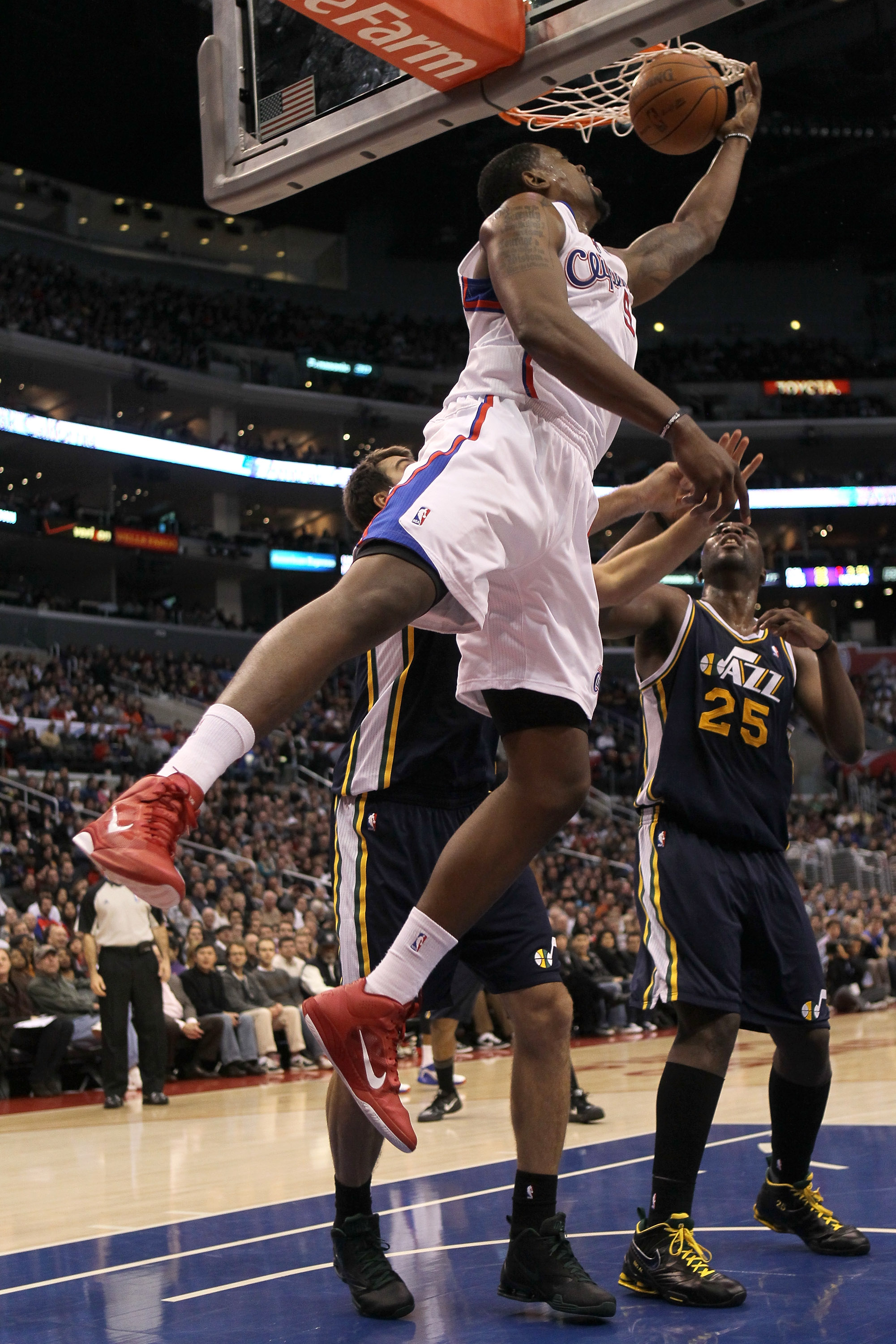 LOS ANGELES, CA - DECEMBER 29:  DeAndre Jordan #9 of the Los Angeles Clippers tries to get off a shot against the Utah Jazz at Staples Center on December 29, 2010 in Los Angeles, California.       The Jazz won 103-85.  NOTE TO USER: User expressly acknowl