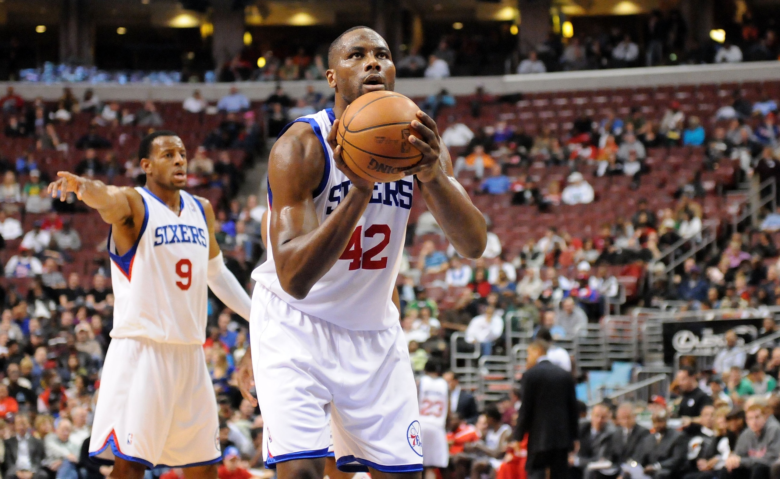 PHILADELPHIA - NOVEMBER 03: Elton Brand #42 of the Philadelphia 76ers gets set to shoot a free throw as Andre Iguodala #9 gestures to a teammate against the Boston Celtics at the Wachovia Center on November 3, 2009 in Philadelphia, Pennsylvania. NOTE TO PHILADELPHIA - NOVEMBER 03: Elton Brand #42 of the Philadelphia 76ers gets set to shoot a free throw as Andre Iguodala #9 gestures to a teammate against the Boston Celtics at the Wachovia Center on November 3, 2009 in Philadelphia, Pennsylvania. NOTE TO