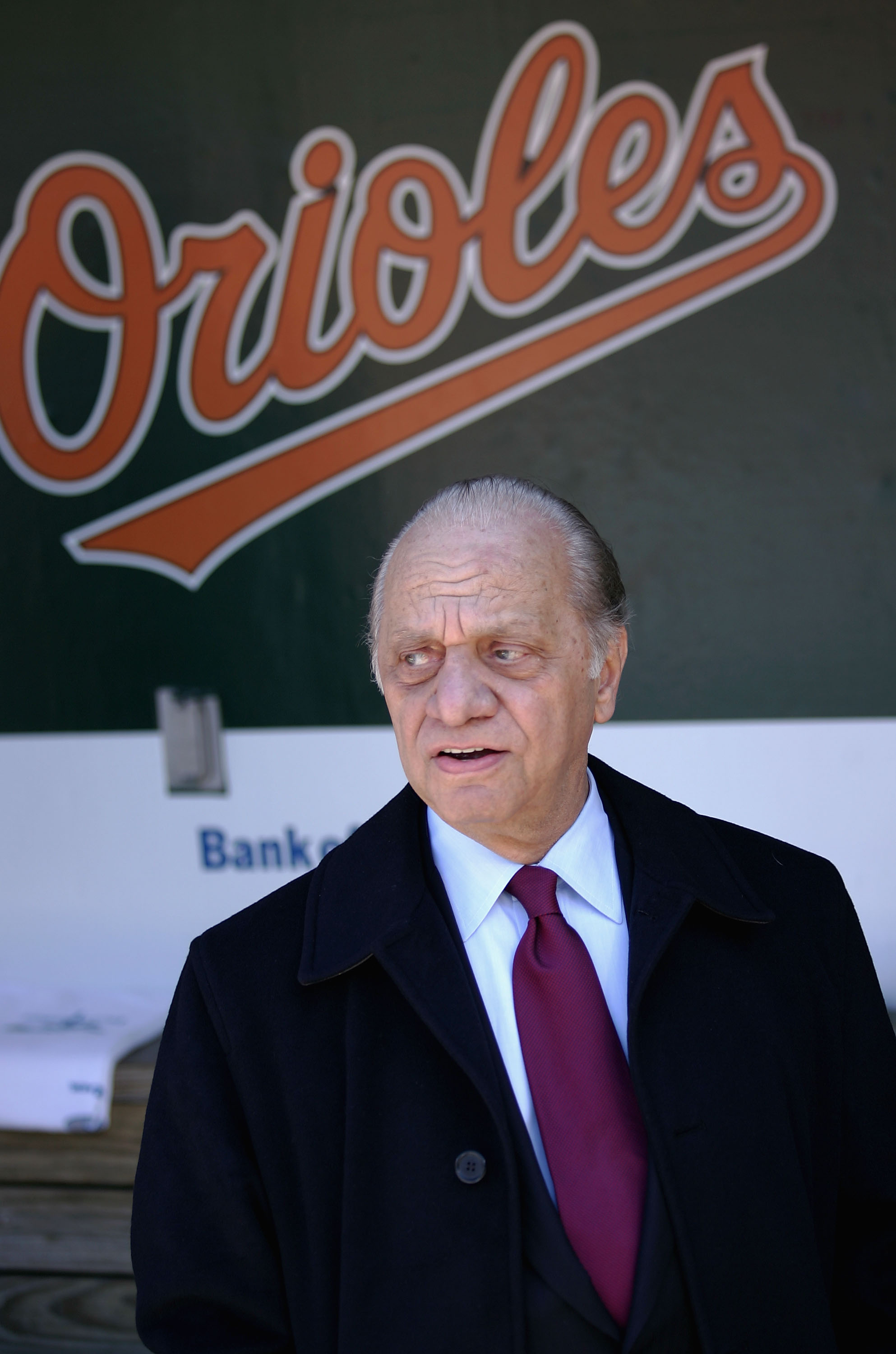 BALTIMORE - APRIL 4:  Owner Peter Angelos of the Baltimore Orioles watches pregame festivities from the duggout prior to the Baltimore Orioles defeating the Oakland Athletics 4-0 on opening day, April 4, 2005 at Oriole Park at Camden Yards in Baltimore, M
