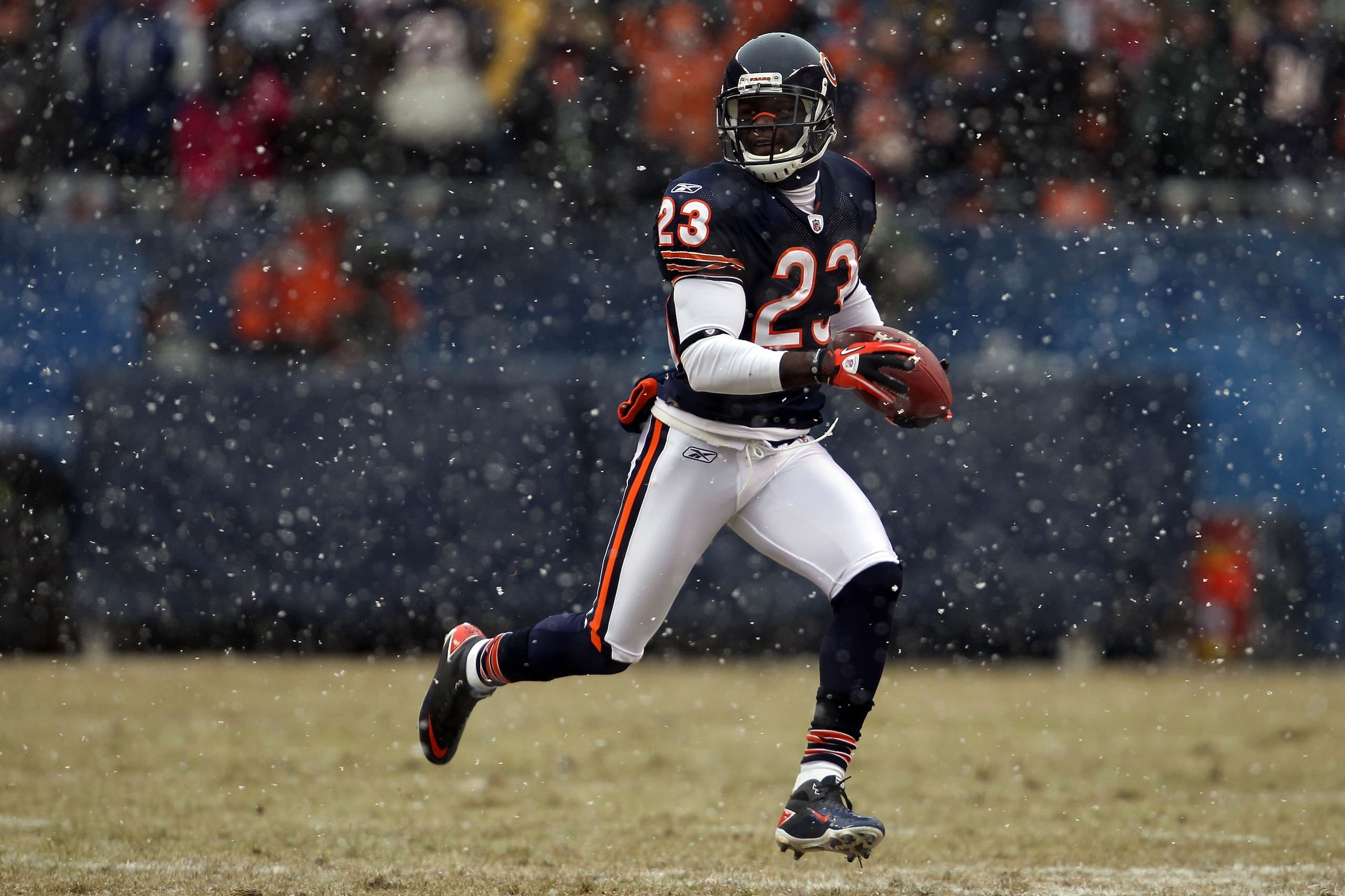 CHICAGO, IL - JANUARY 16:  Kick returner Devin Hester #23 of the Chicago Bears returns a punt in the first half against the Seattle Seahawks in the 2011 NFC divisional playoff game at Soldier Field on January 16, 2011 in Chicago, Illinois.  (Photo by Jona