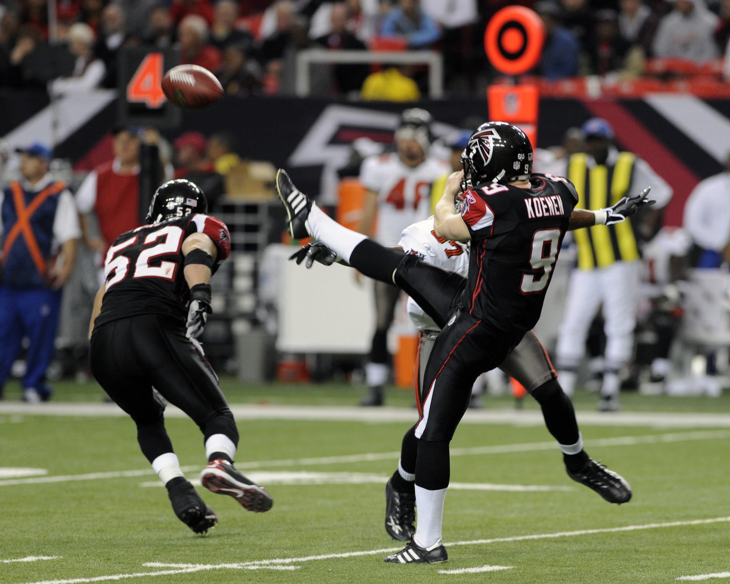 ATLANTA - DECEMBER 14:  Punter Michael Koenen #9 of the Atlanta Falcons follows through on a blocked punt by the Tampa Bay Buccaneers  at the Georgia Dome on December 14, 2008 in Atlanta, Georgia.  (Photo by Al Messerschmidt/Getty Images)